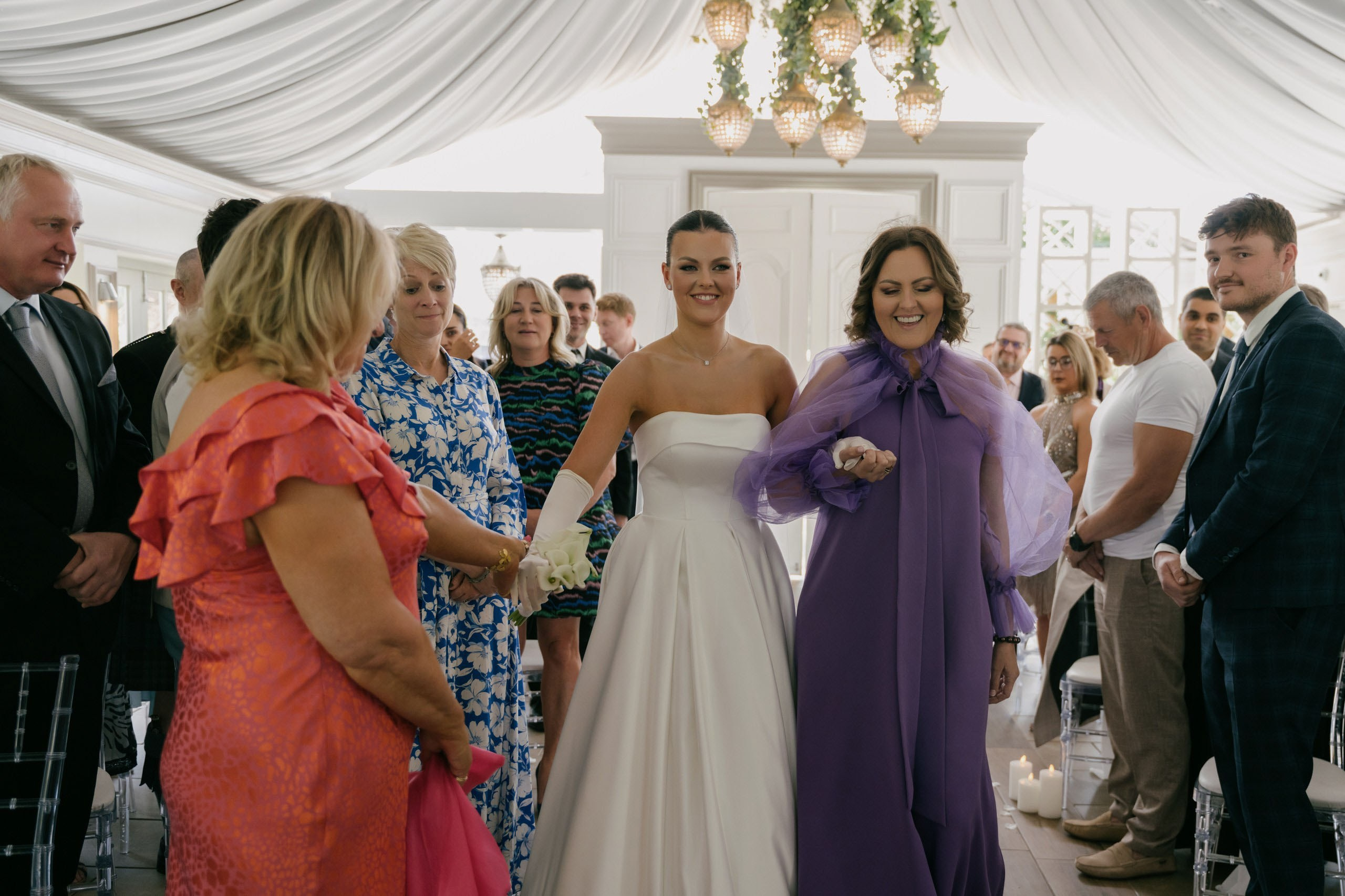 Bride walking down the aisle with emotional expressions wedding ceremony