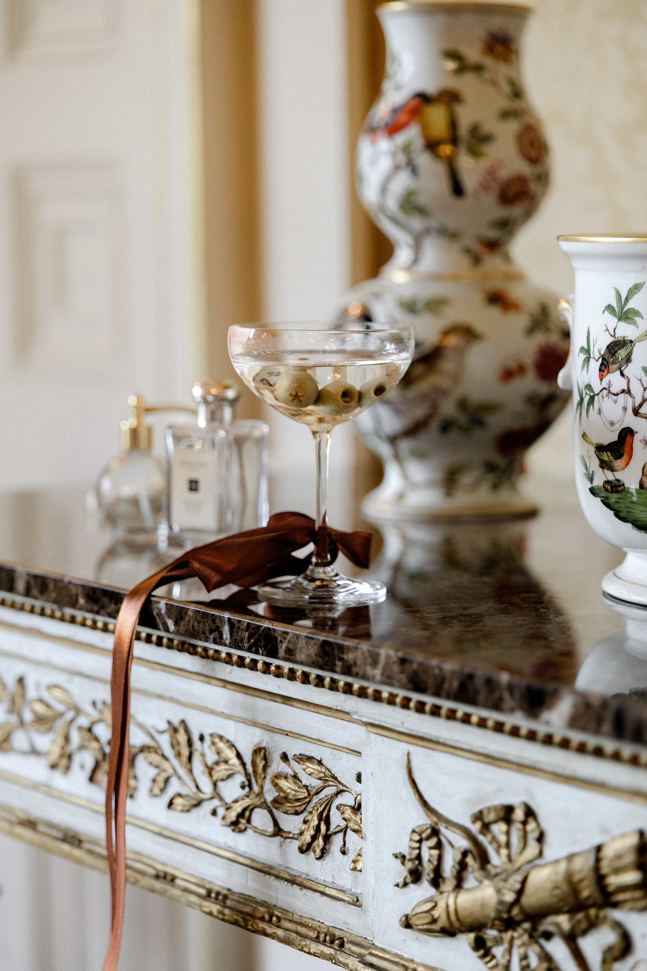 Elegant wedding portrait of bride and groom walking through the streets of ParisRomantic elopement moment captured in soft evening light in Paris, FranceLuxury wedding ceremony setup in a historic French venue with natural floralsCandid black and white photo of a couple at their city wedding in London, UKTimeless couple portrait in front of Marylebone Town Hall, LondonEditorial-style bridal preparation in a classic townhouse in the heart of LondonSoft light bridal portrait in a countryside château wedding in FranceFine art flat lay with French-inspired wedding details and vintage texturesCinematic golden hour photo at a UK estate wedding with historic architectureLuxury wedding tablescape with candles and florals at a London reception
