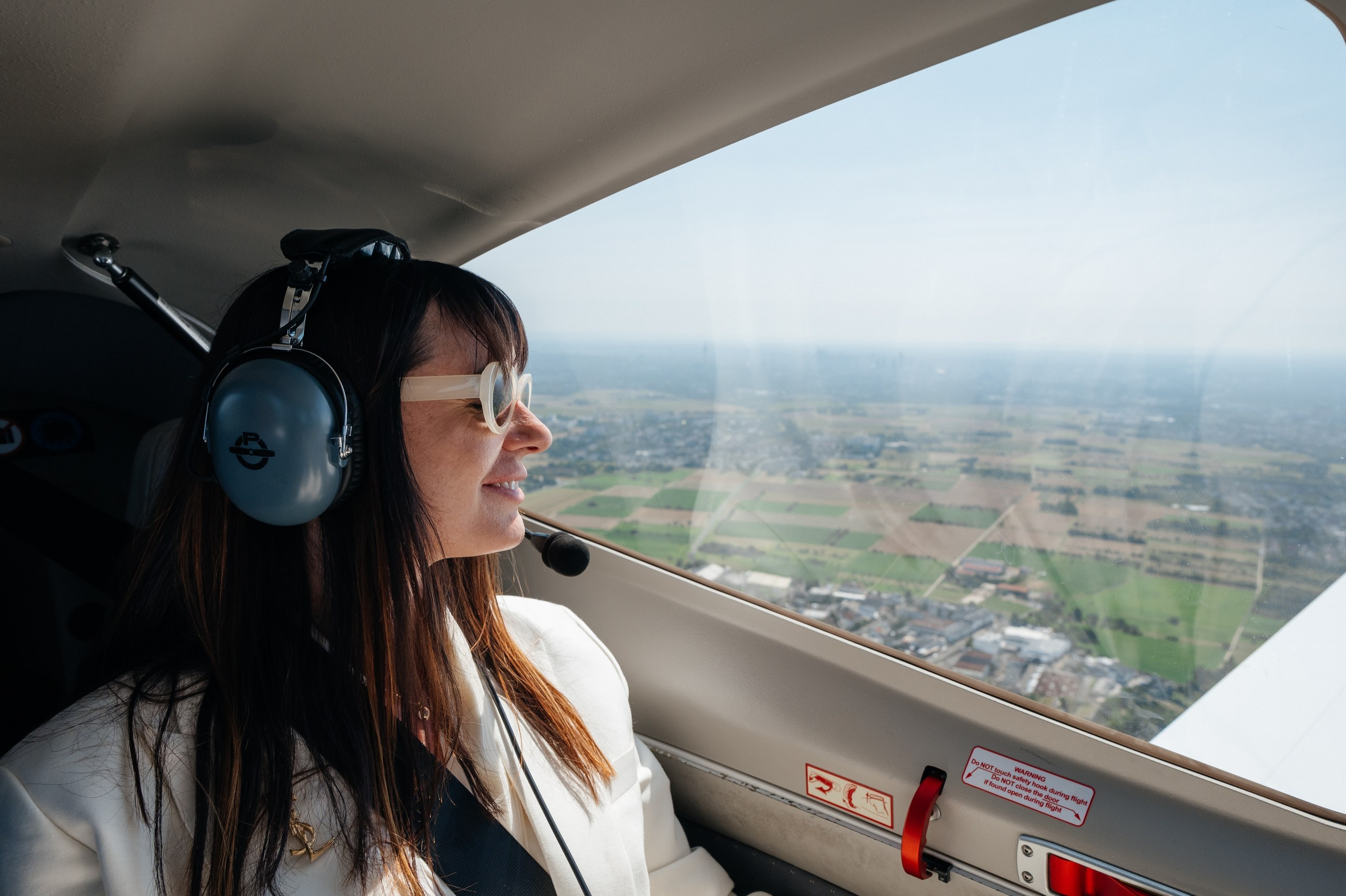 bride looks out of the airplane window