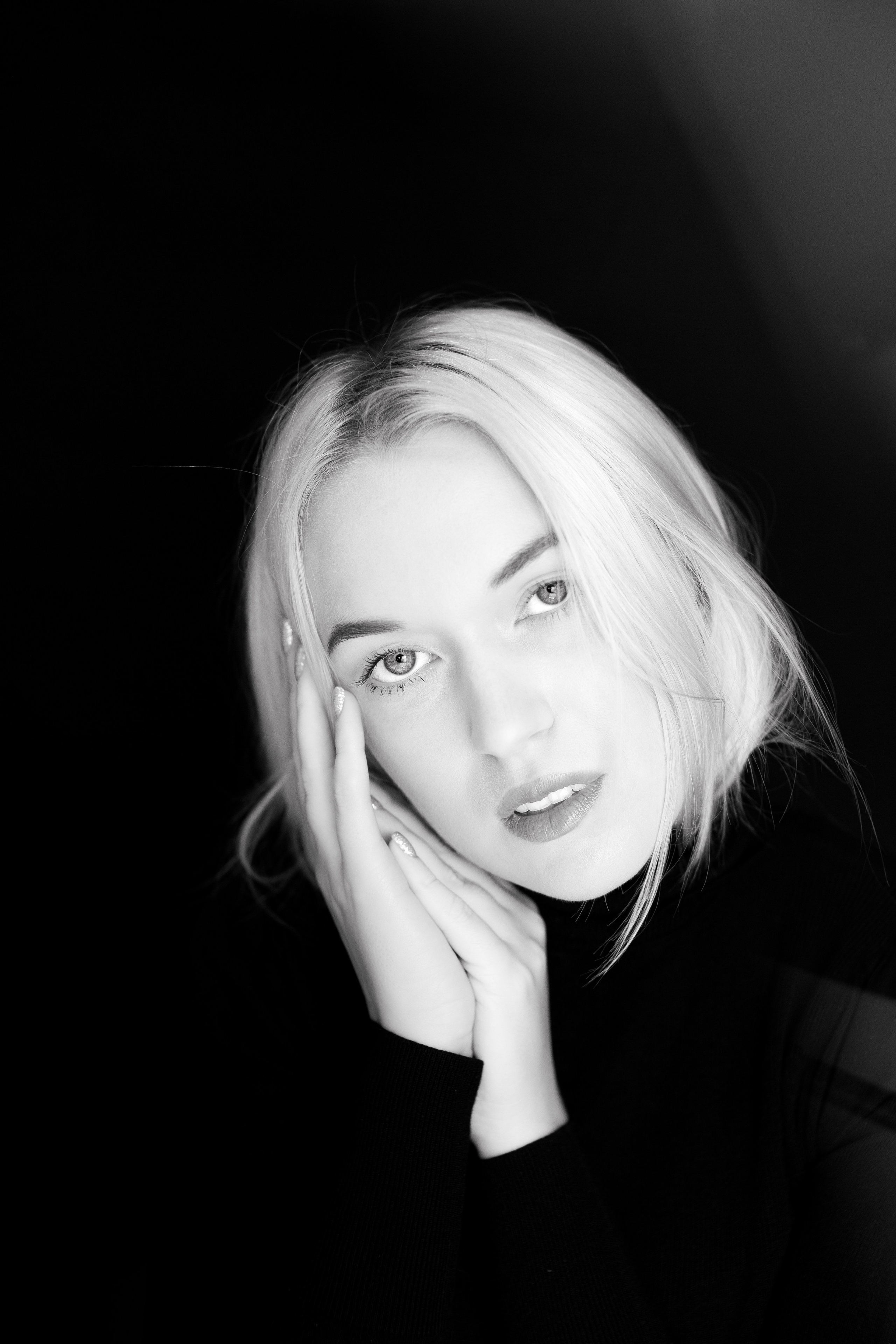Artistic moody portrait female black and white. Artistic moody black and white female portrait with soft blur, fine art experimental photography. 