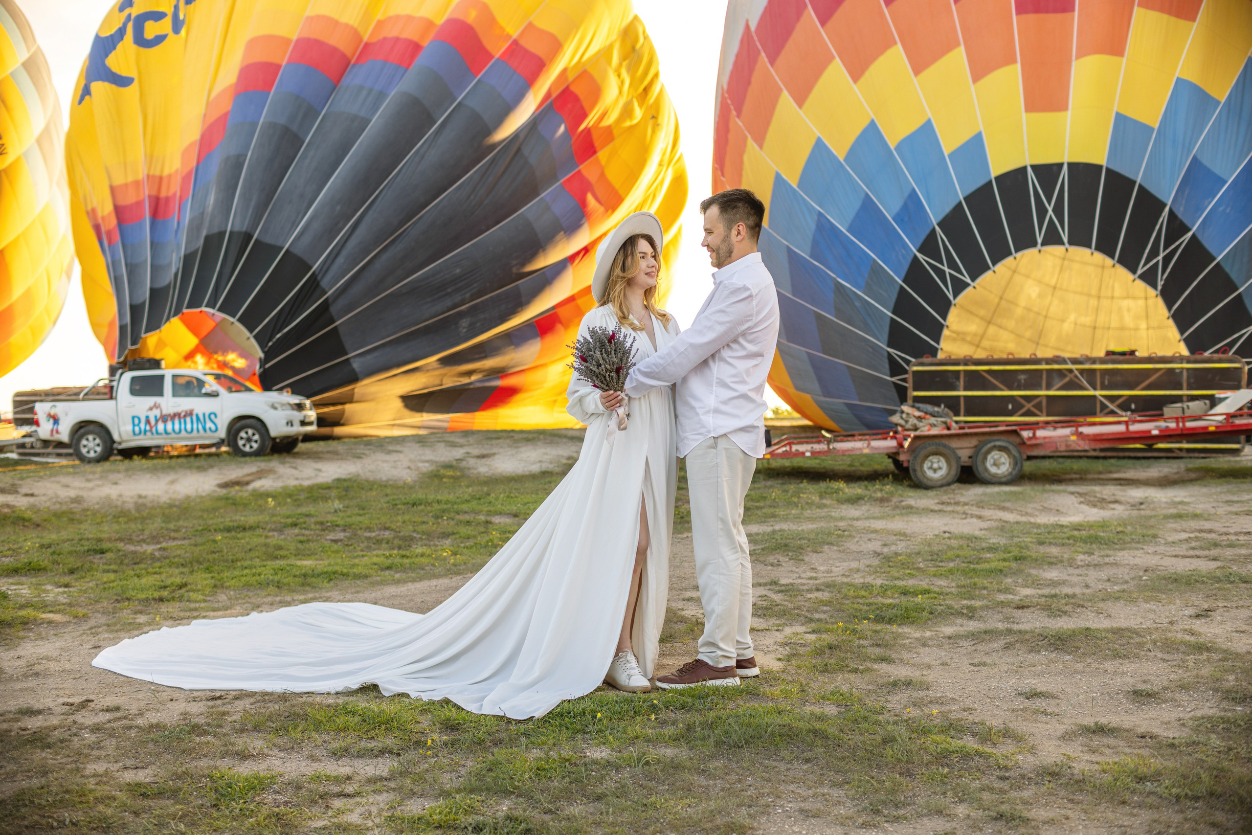 Elegant Wedding Photoshoot with a Flowing Dress and Balloons in Cappadocia. Julia Ganch I Fashion Wedding Photography I Cappadocia Turkey