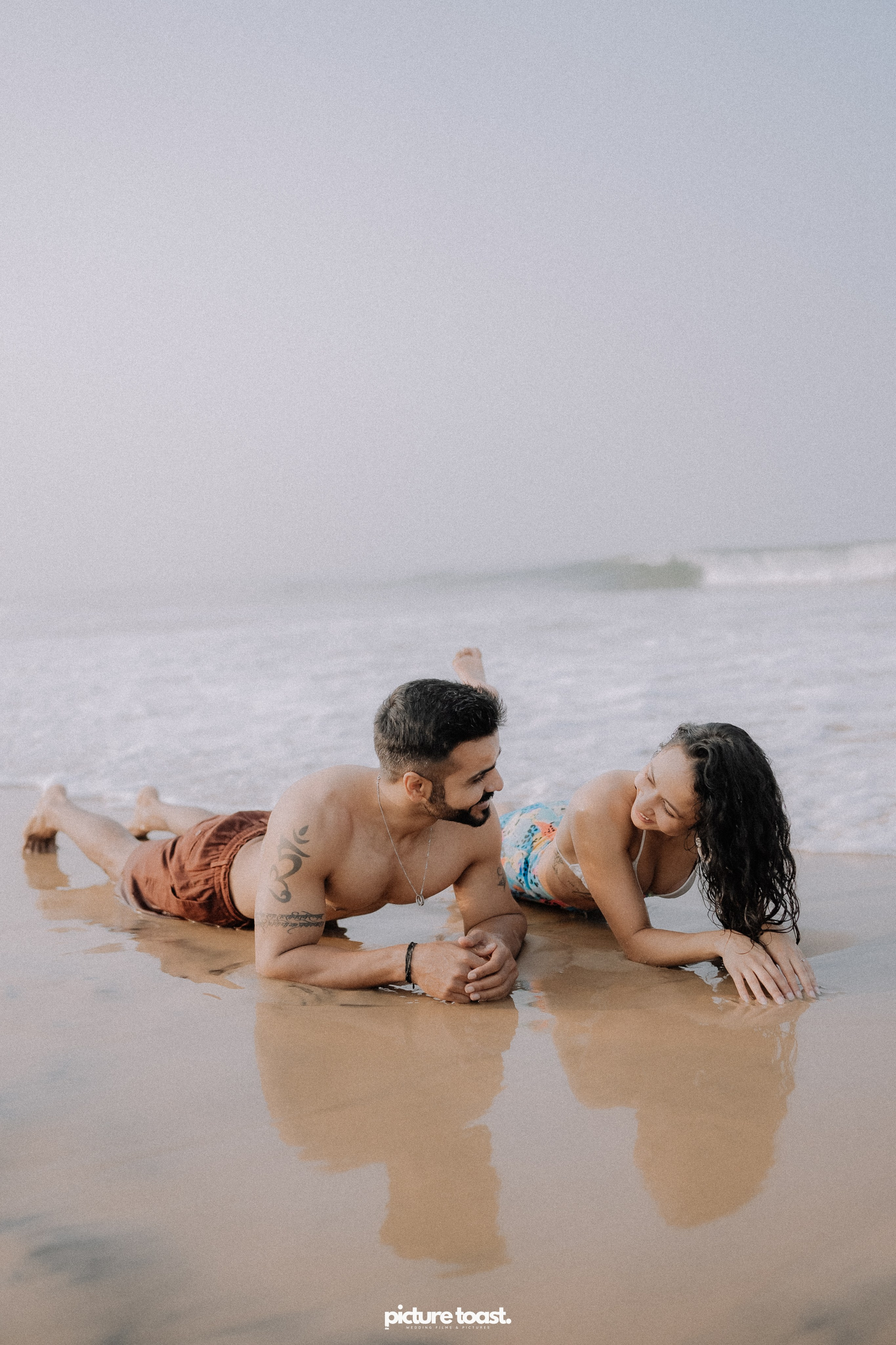 Love In The Beach. Fine art Wedding Photographers in India & Canada