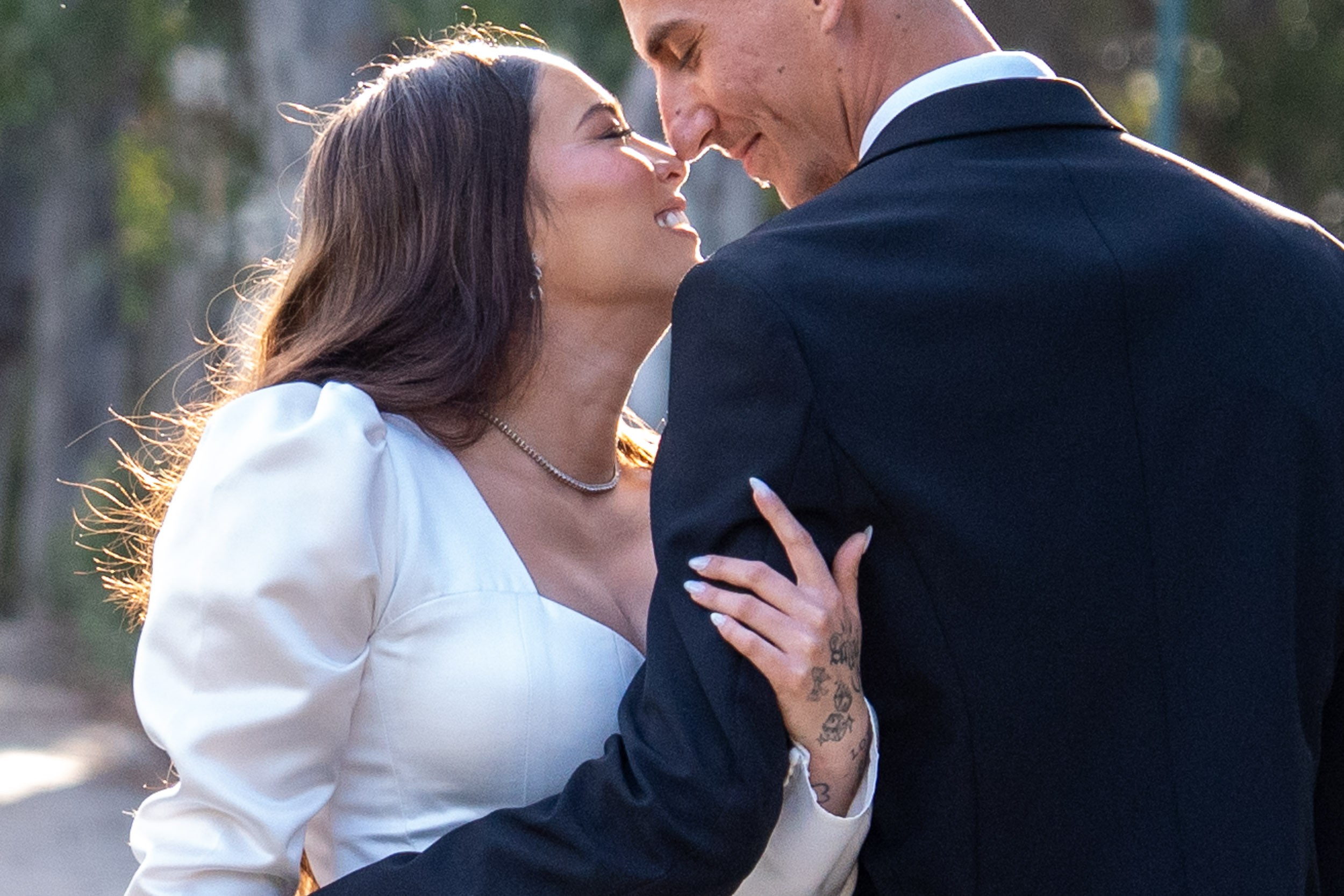 Bride Lin and groom Garik sharing a close romantic moment during their outdoor wedding photoshoot in Hadera, Israel