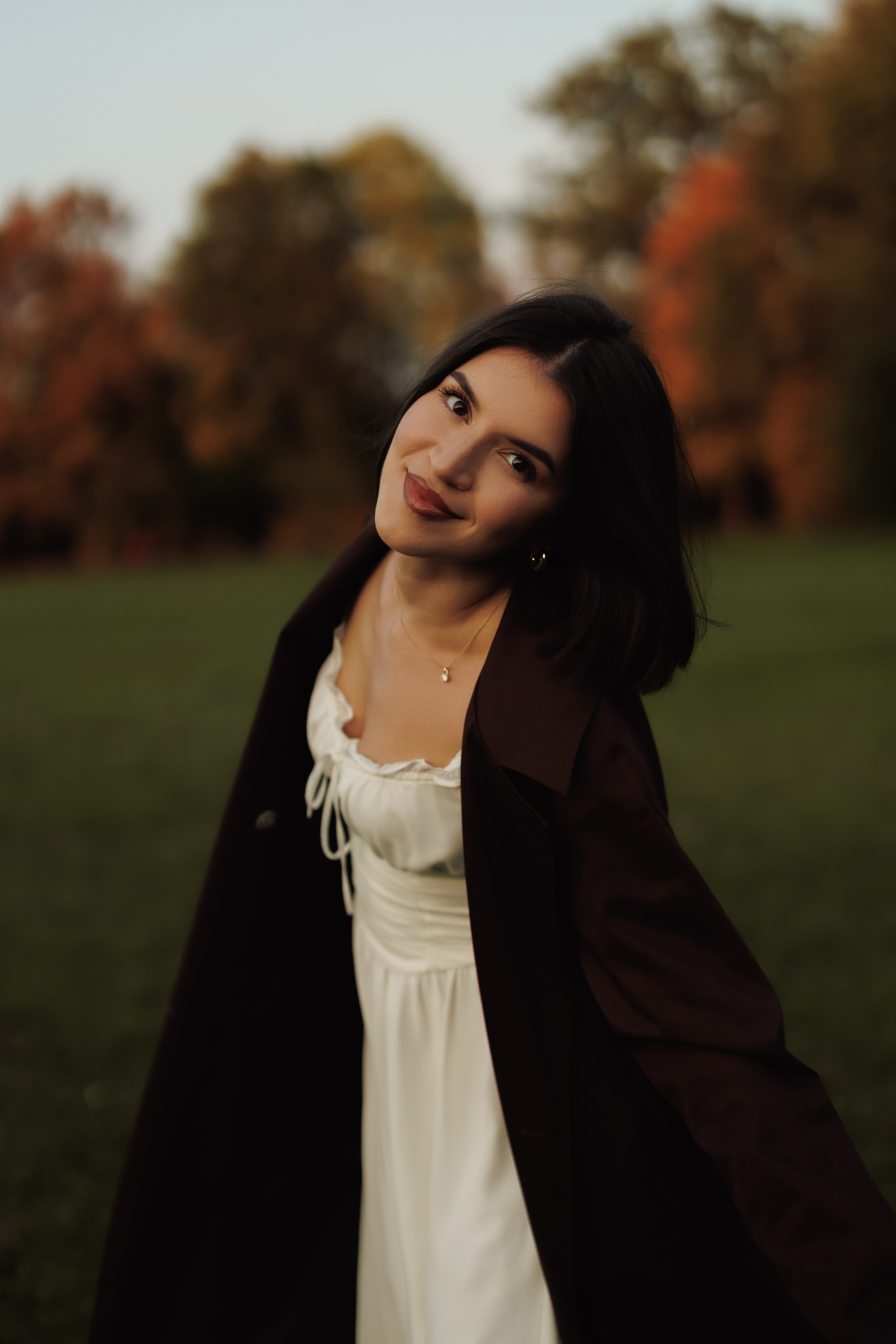 Autumn Park Photoshoot | Woman in White Dress. Cinematic&Elegant Portraits by Kristina Kozheltsova. Kristina Kozheltsova- Soulful Portrait&Lifestyle&Love Story Photographer in Leipzig, Germany