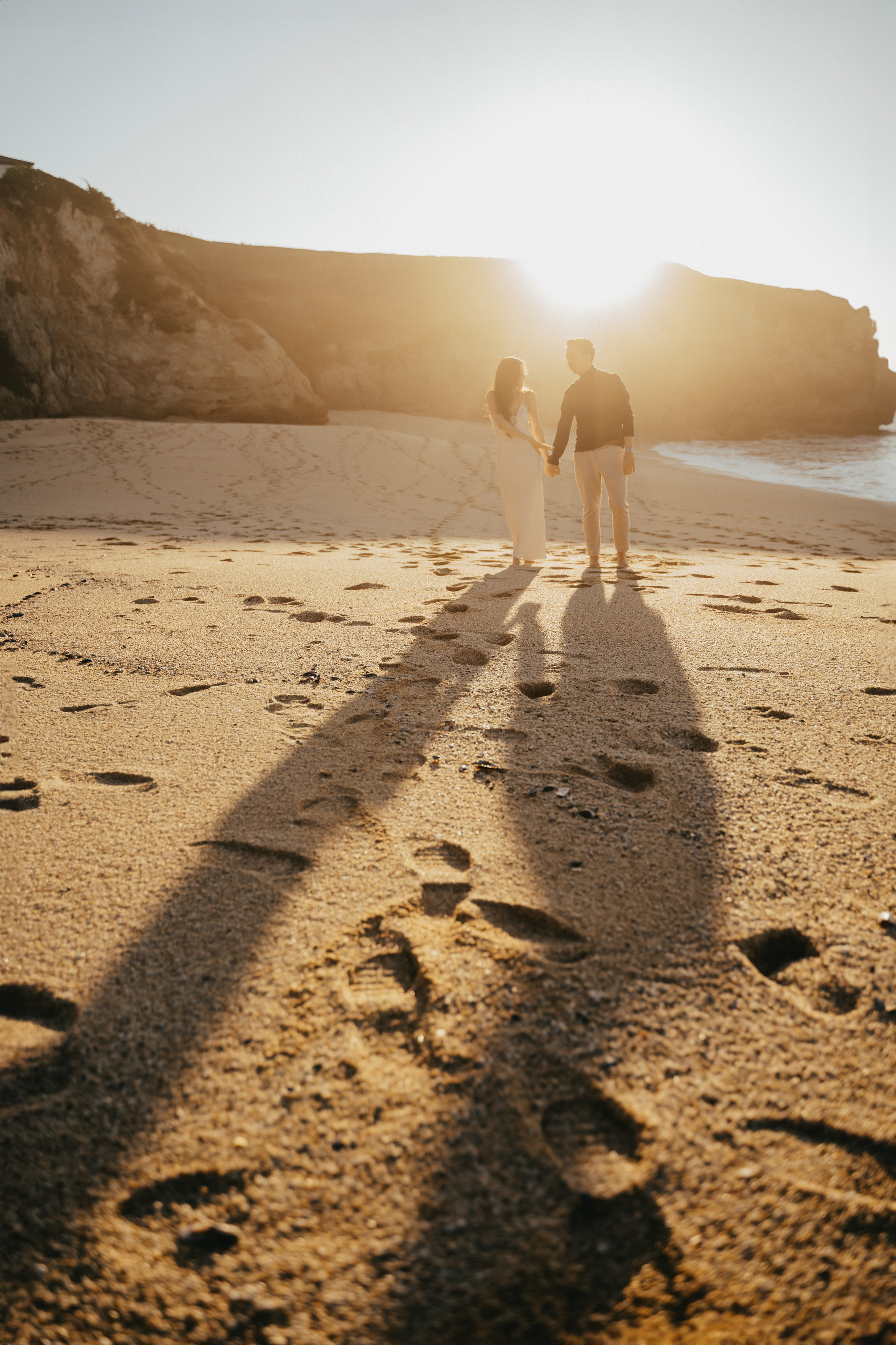 A photo shoot on the San Francisco beach at sunset. Engagement session. 