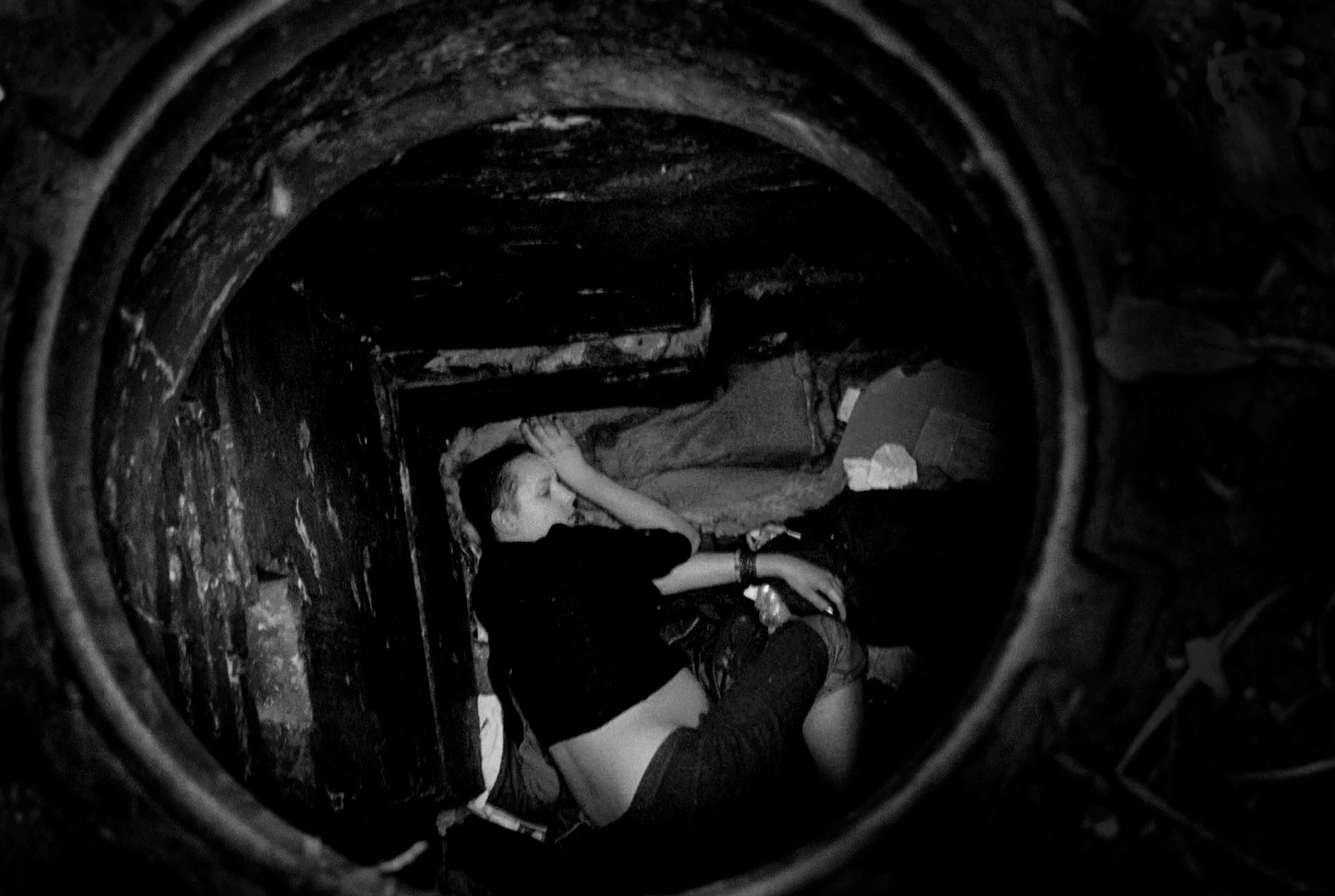 A pregnant Natasha Dzhuley, 16, sleeps after a long night of prostitution. Natasha and several girls work at a mafia controlled flat where they are given clean clothes and instructed to bathe. Natasha was forced to live on the streets after her alcoholic mother who works part-time as a waitress could no longer afford to feed and take care of both Natasha and her brother.