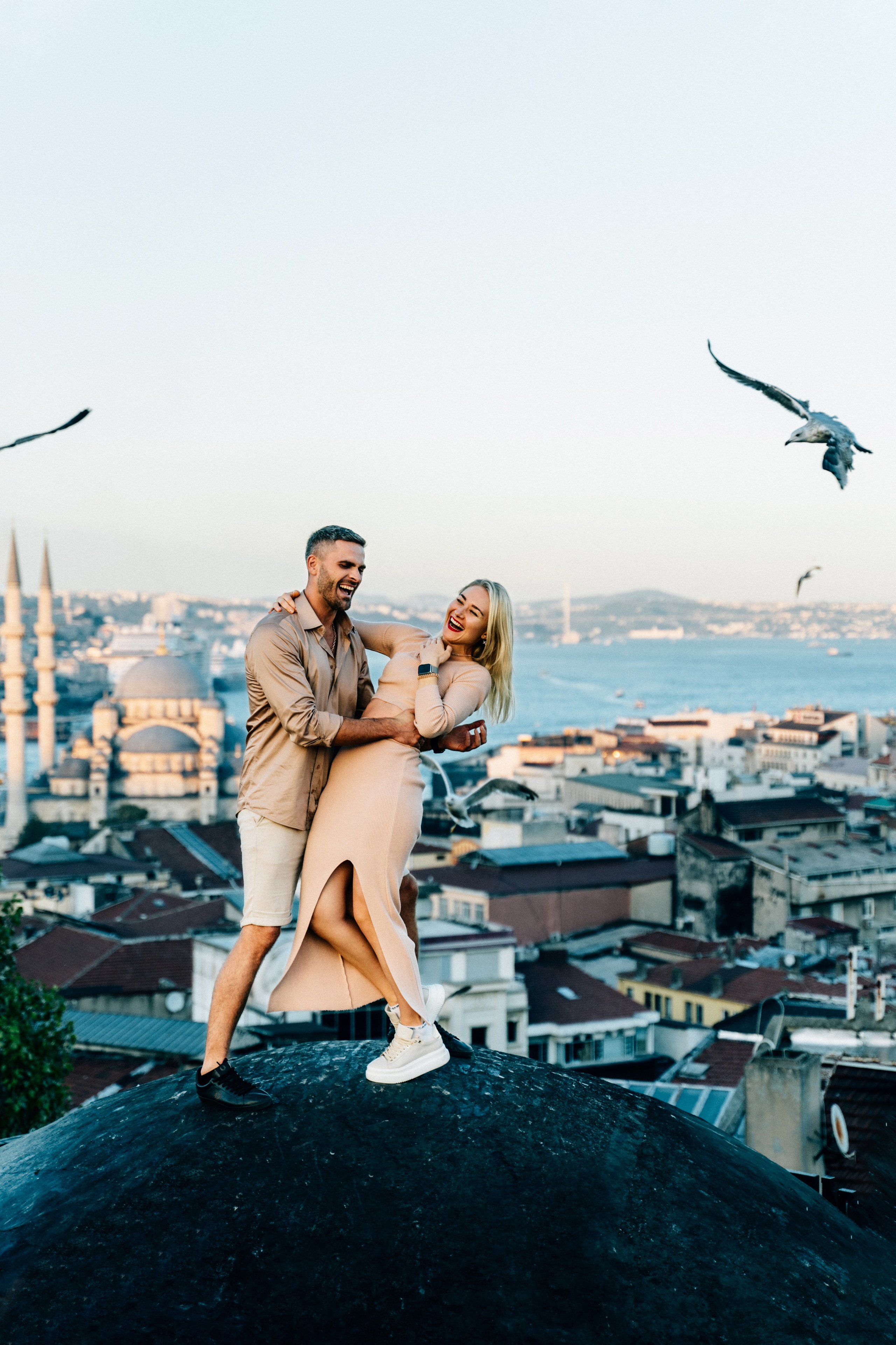 Love story photo shoot on the roof with seagulls in Istanbul