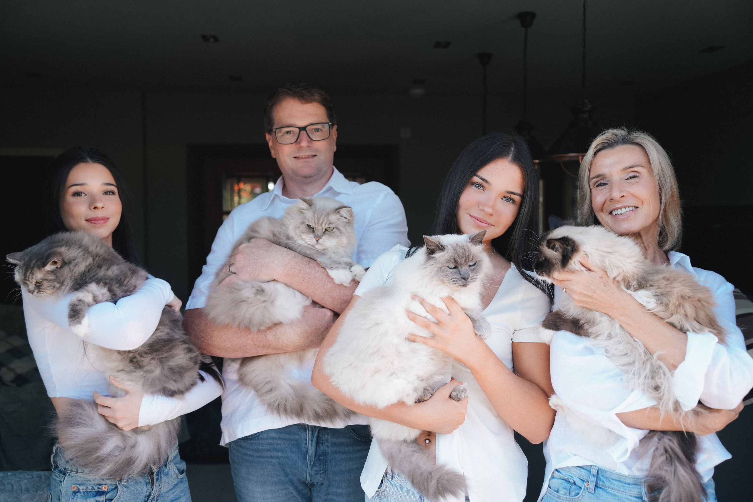 Family portraits at home in Solihull with their cat, relaxed and natural photography.