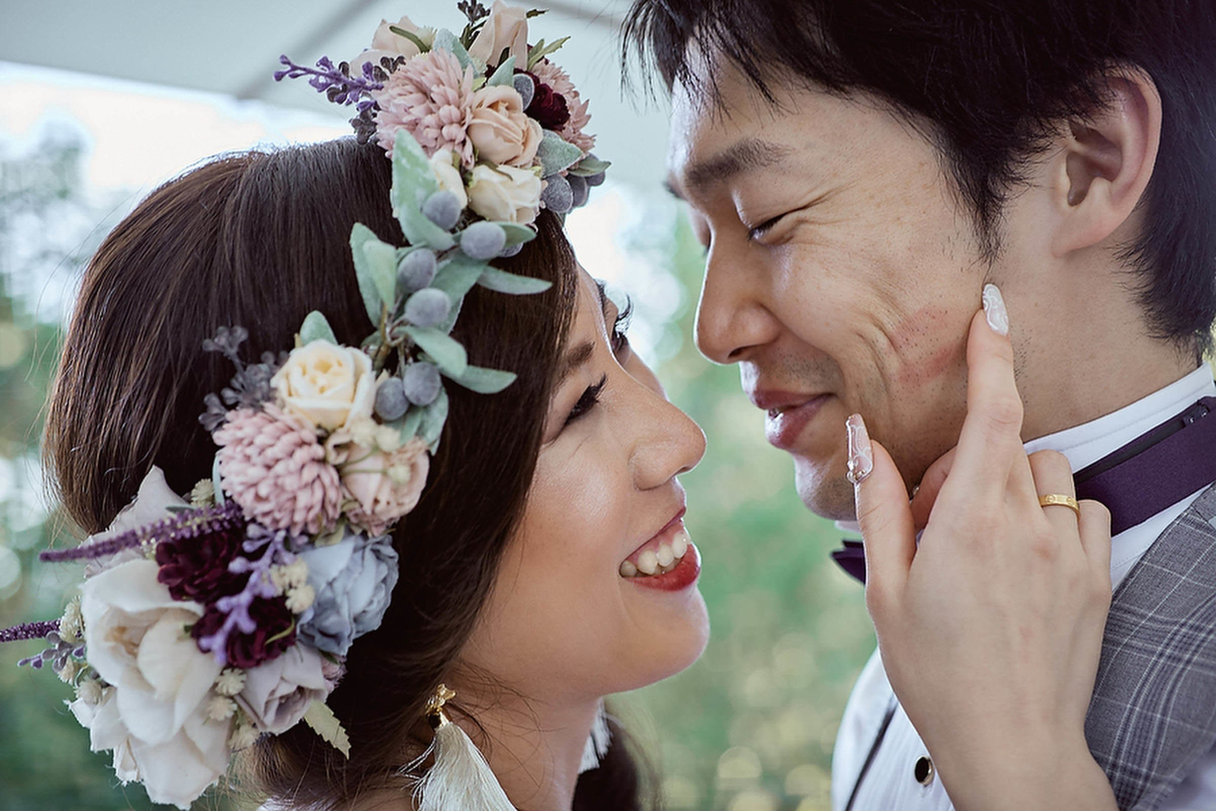 Newlyweds embracing tenderly golden light Lake Bled shore.