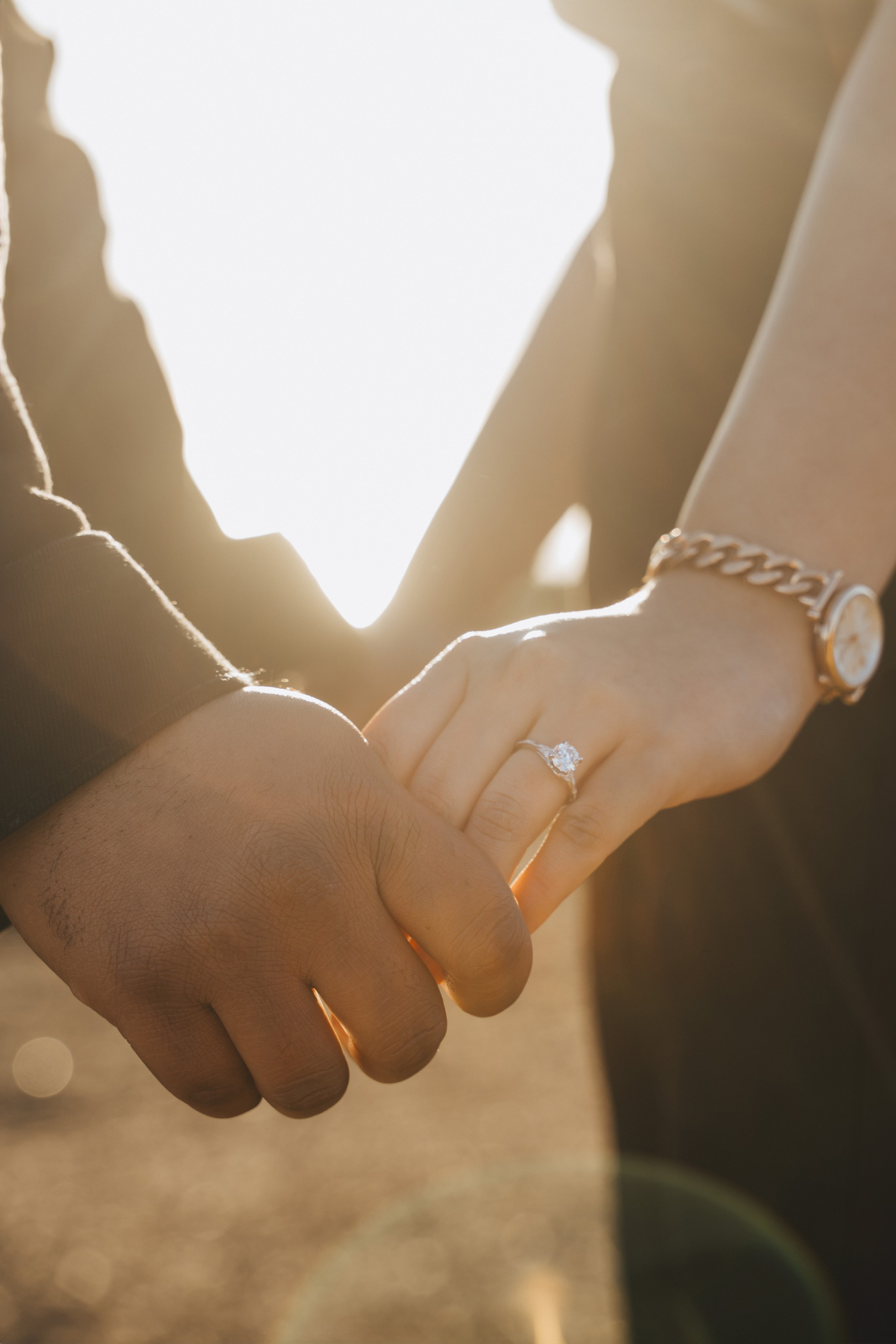 Proposal.  Overlooking the golden San Franisco Bridge sunset with a couple. Photographer Video. 