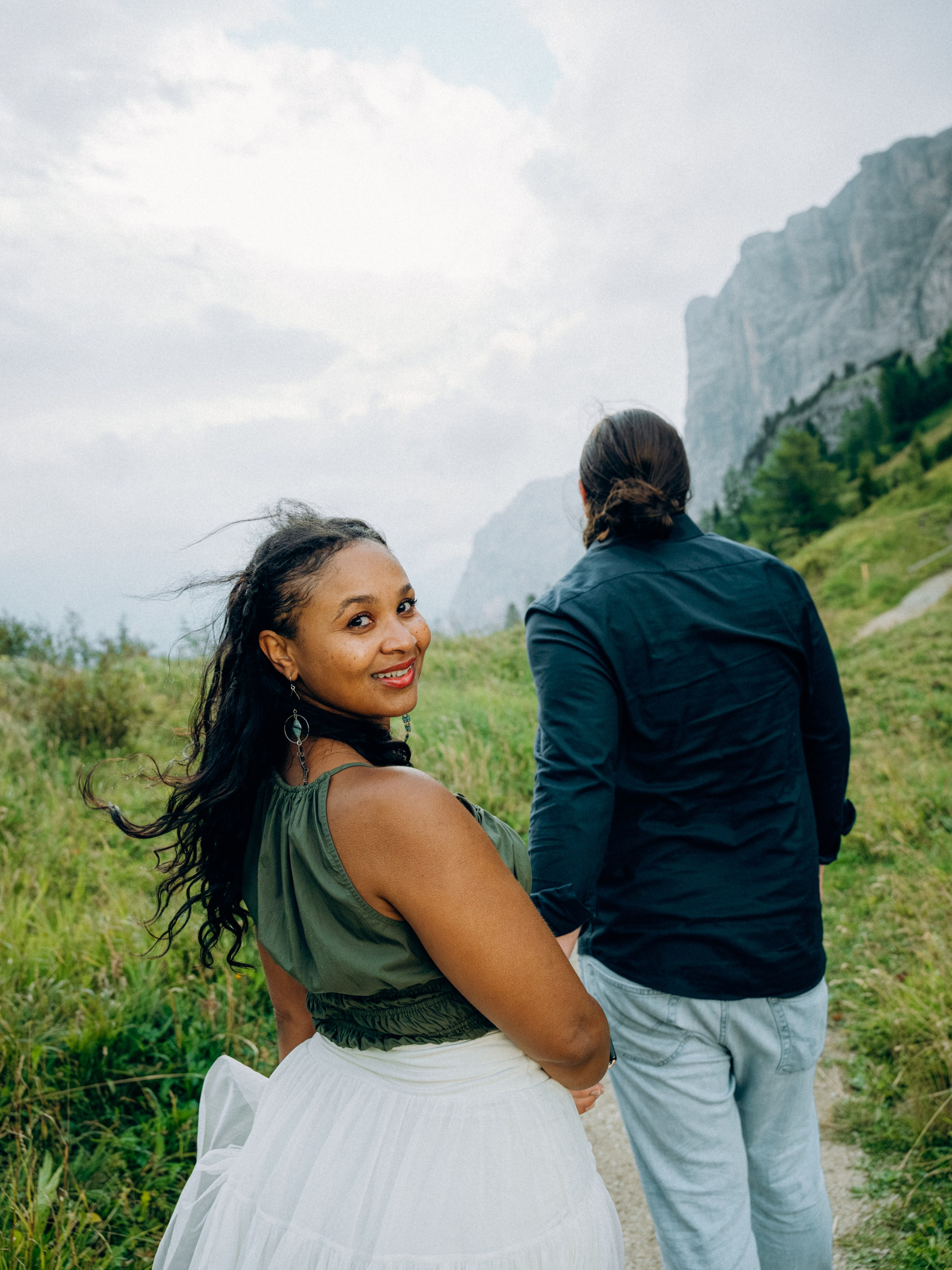 Cinematic walking shot across Dolomites alpine terrain near Ortisei