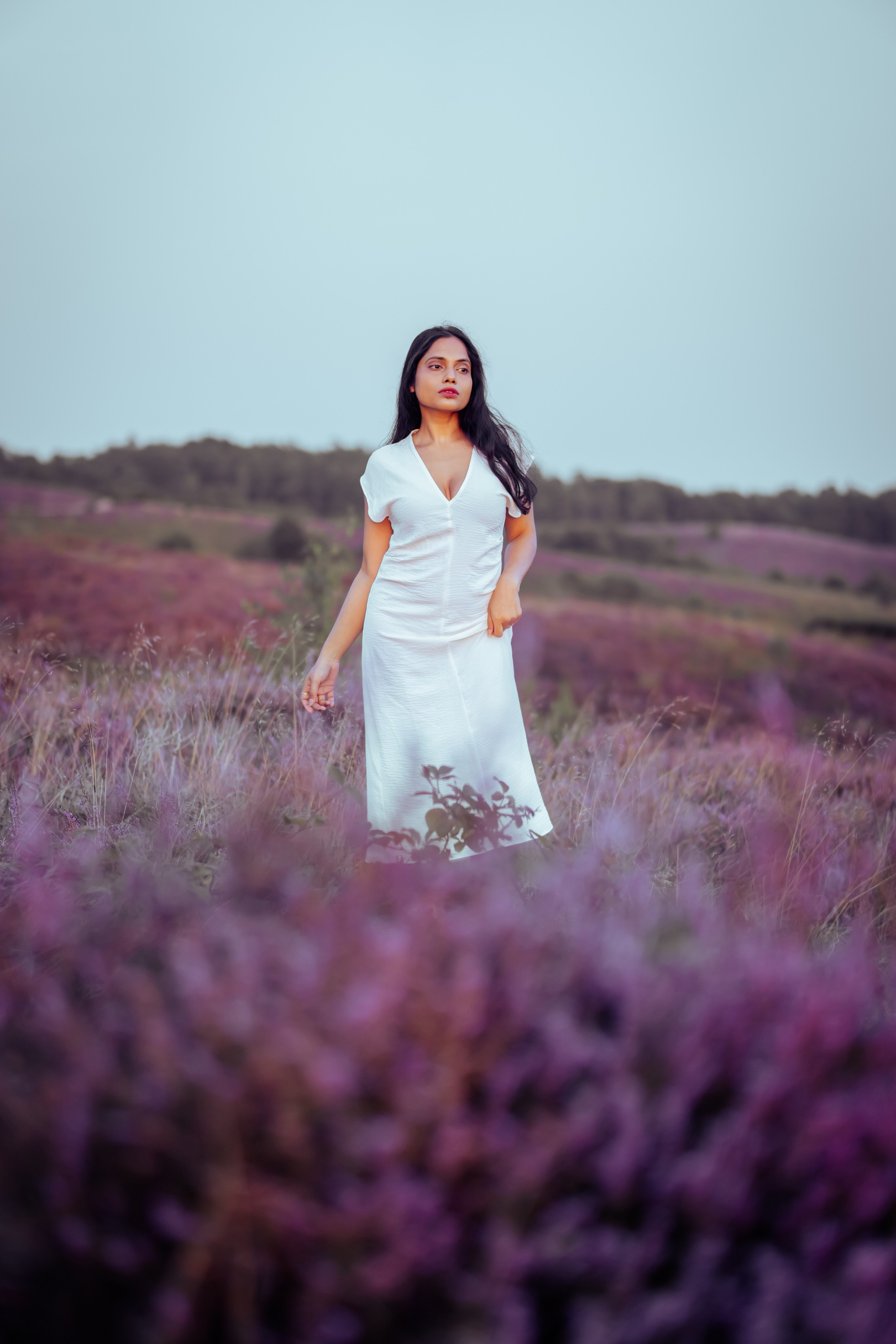 woman standing in veluwe heather fields netherlands