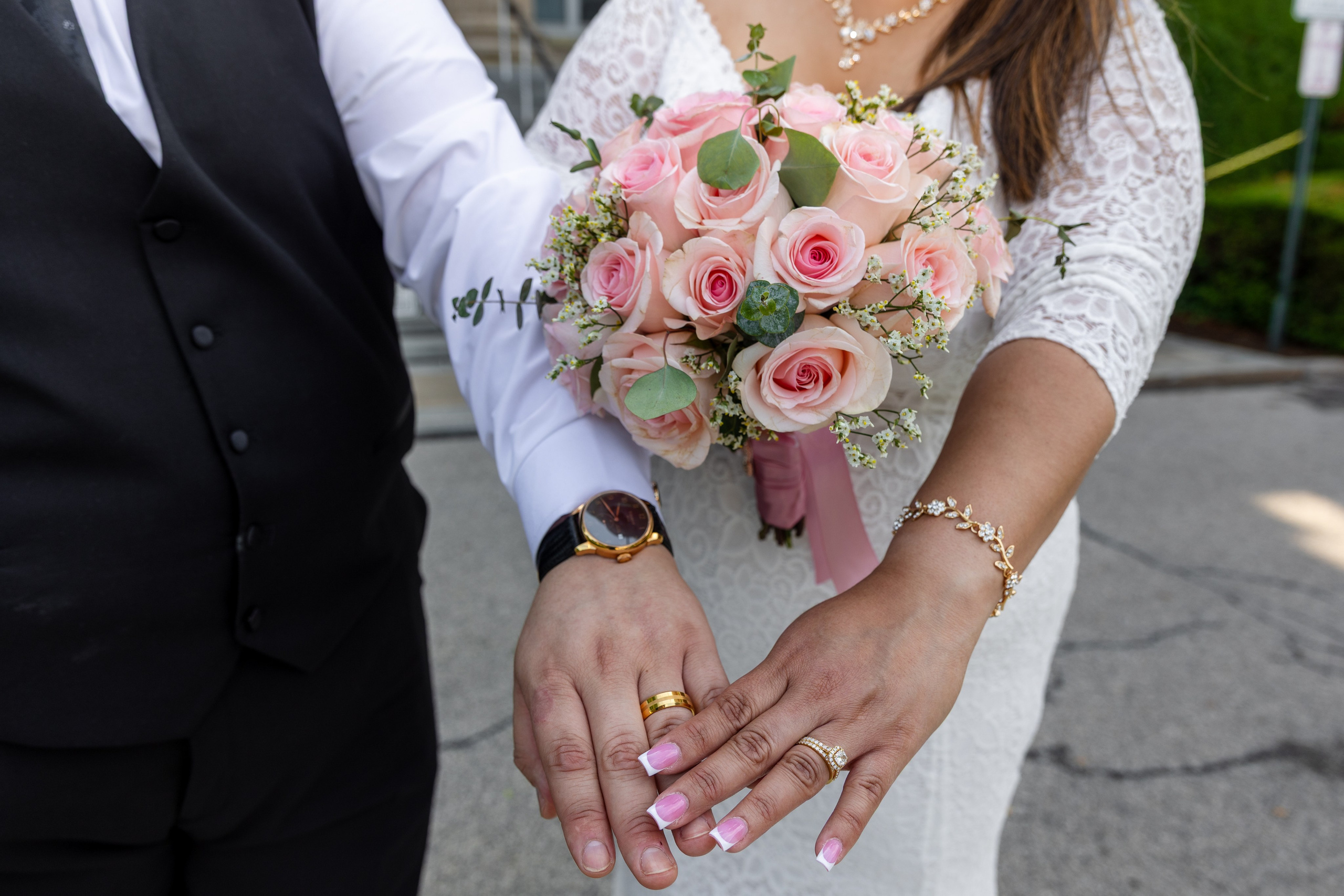 Bride and groom sharing a romantic embrace on the courthouse steps in New Rochelle