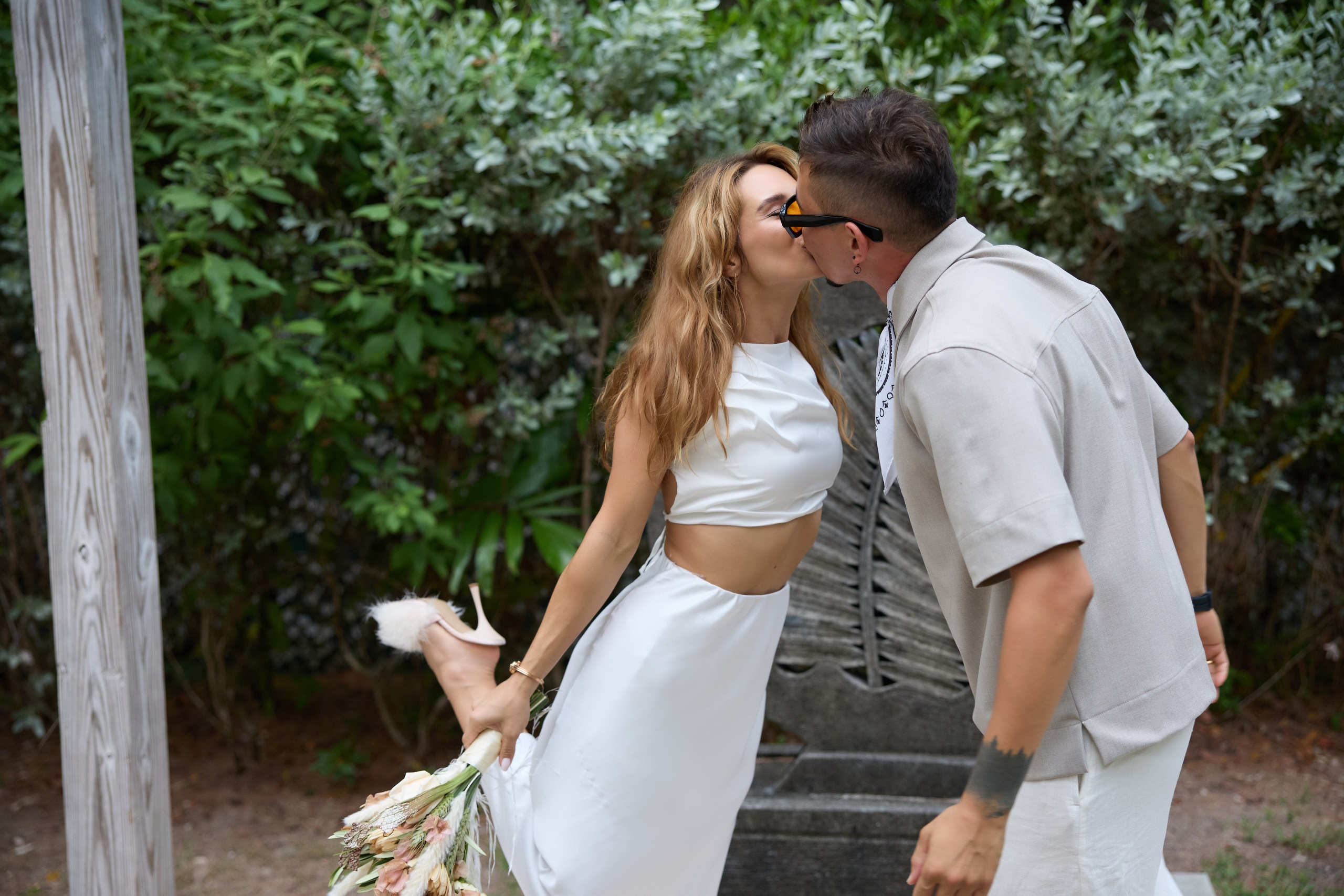 Bride and groom sharing a kiss after their wedding ceremony