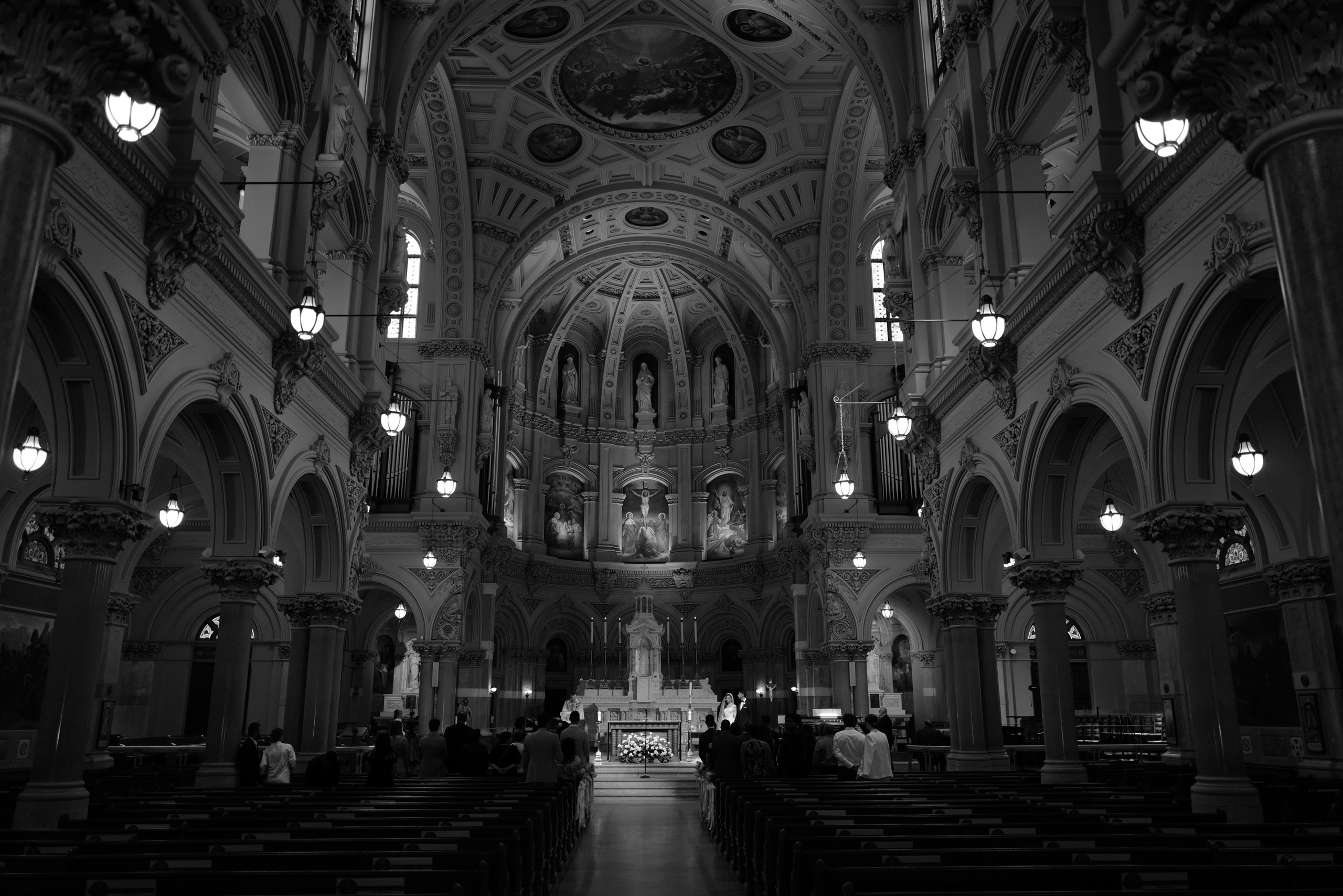 a church with a couple walking down the aisle