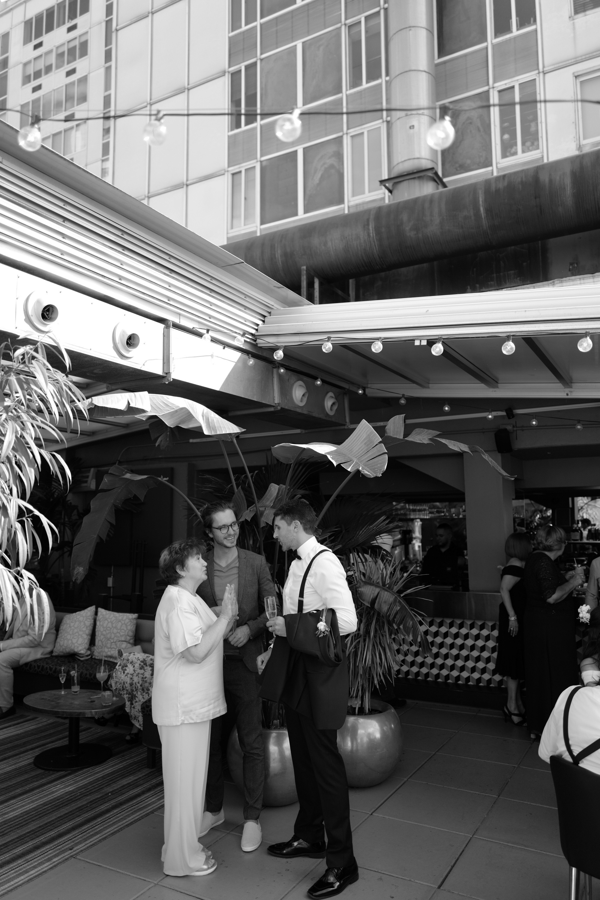 a couple is standing under an umbrella