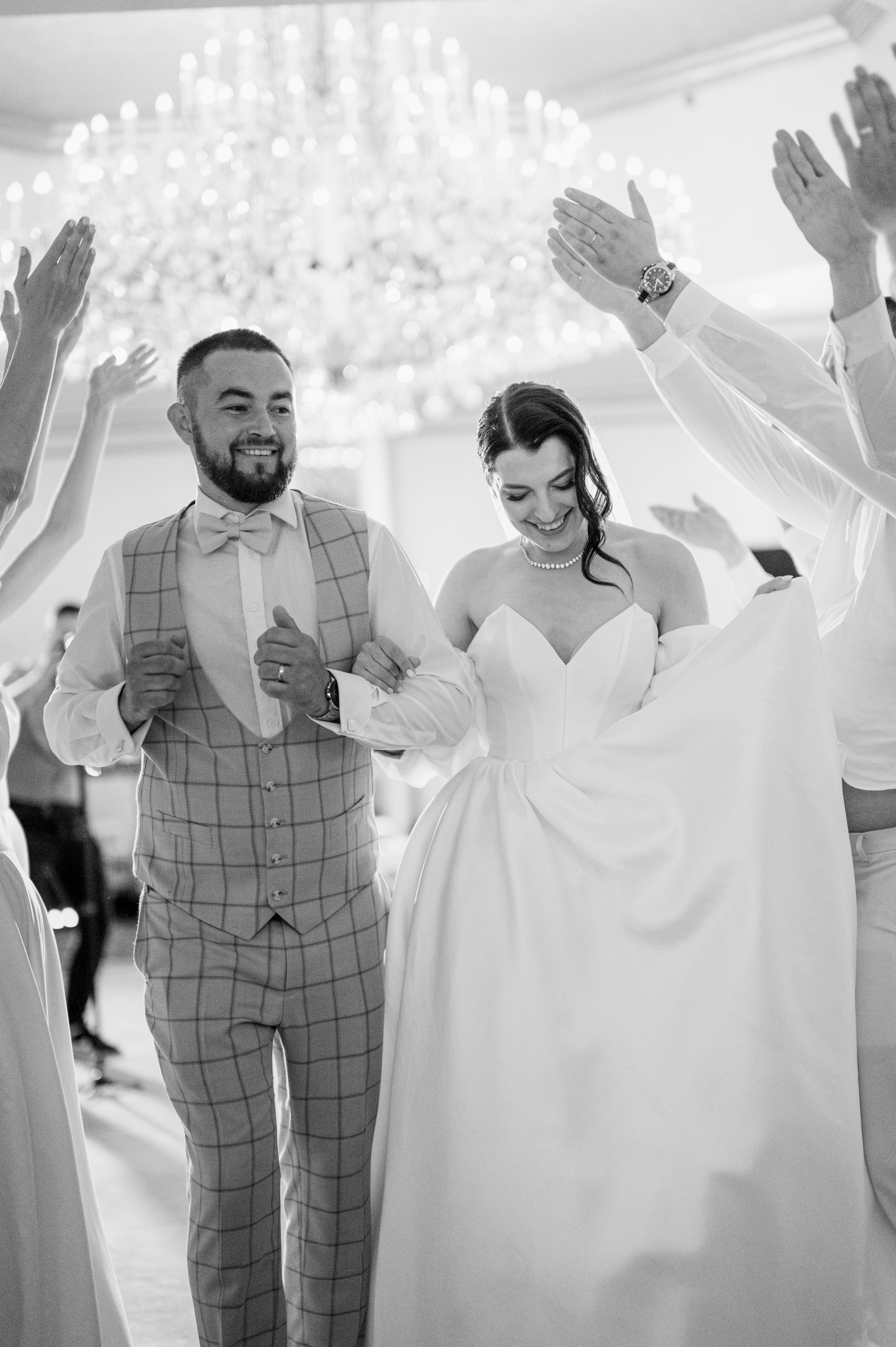 a bride and groom are dancing together