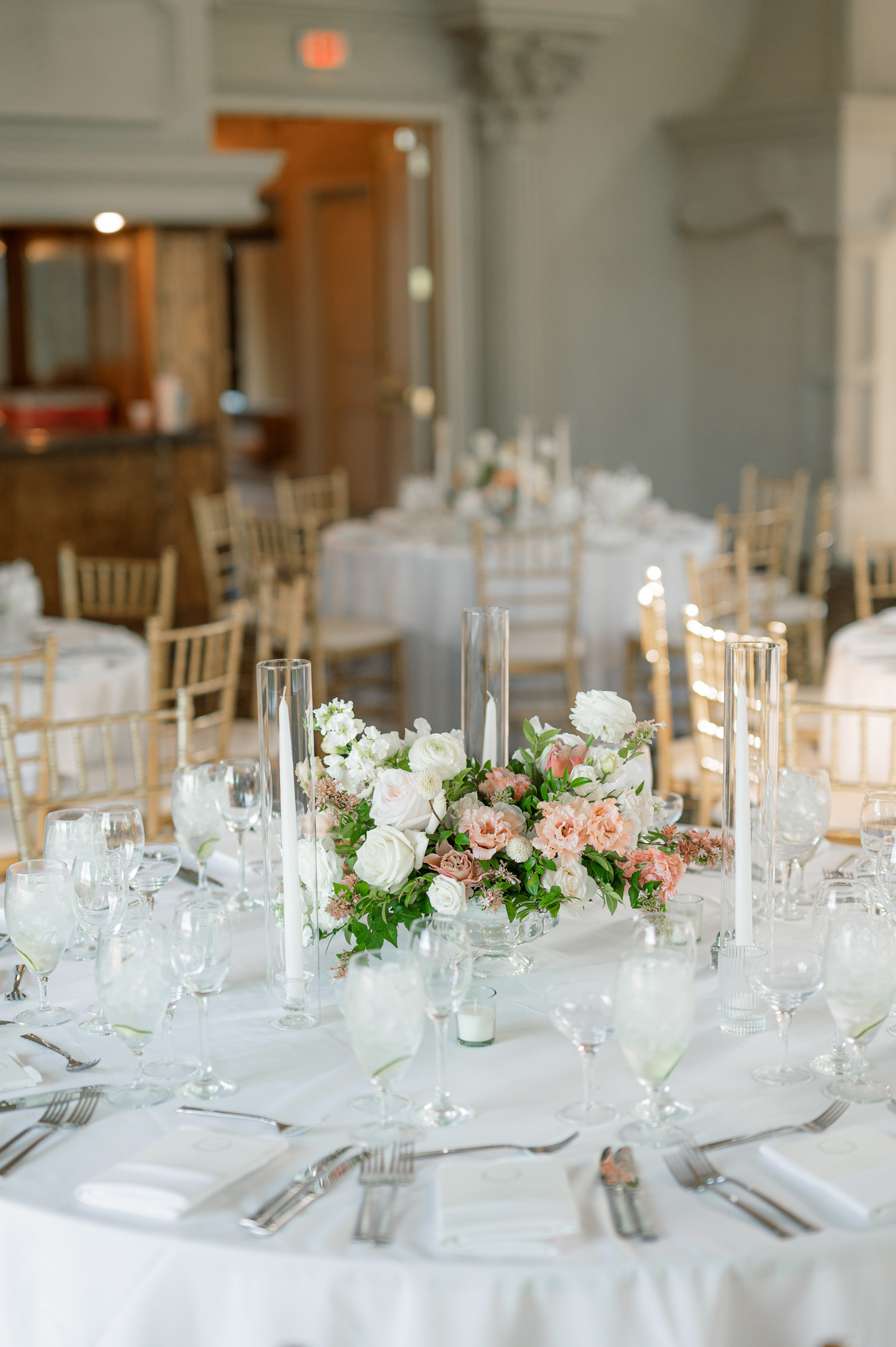 a table with white linen and flowers