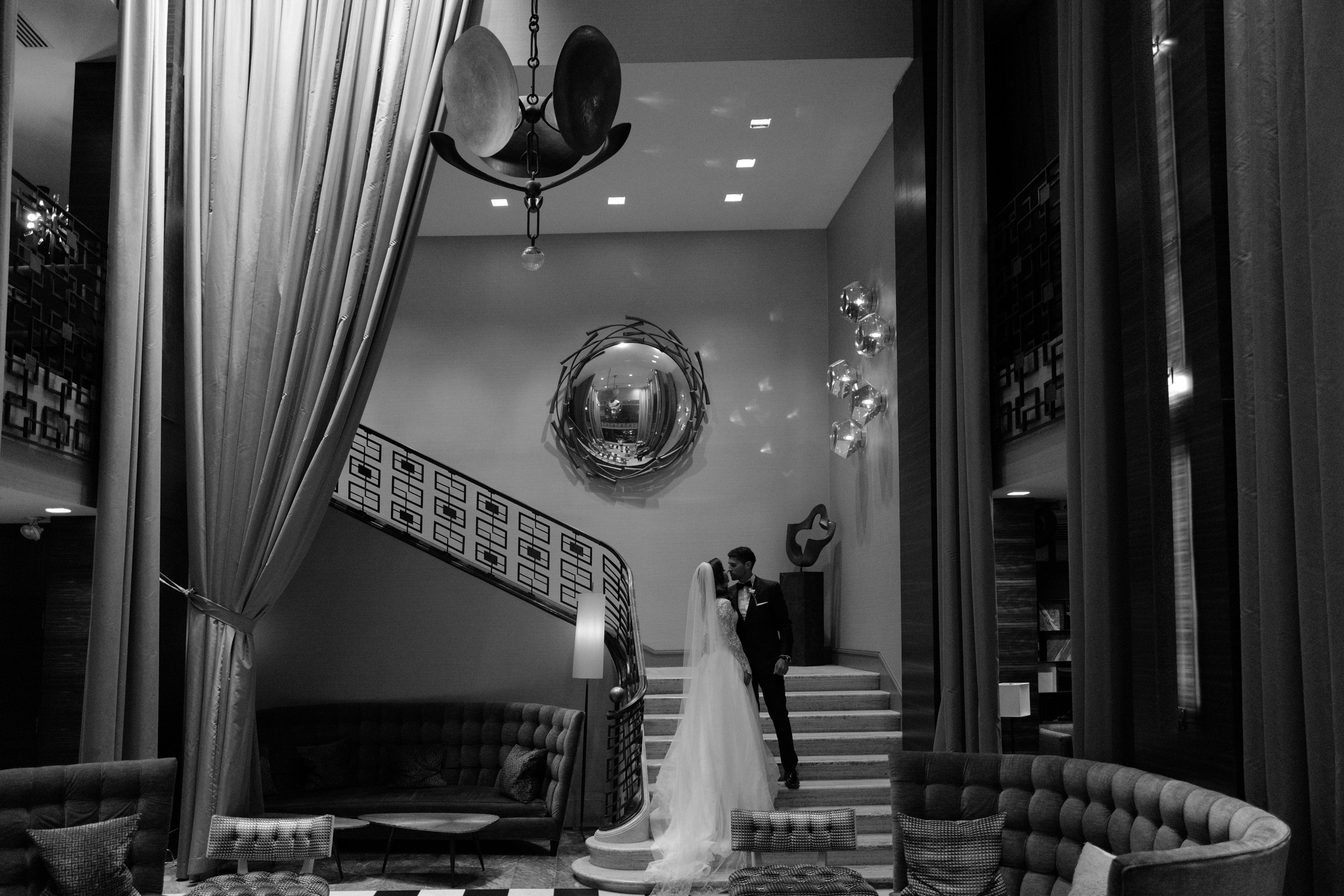 a bride and groom standing in a room