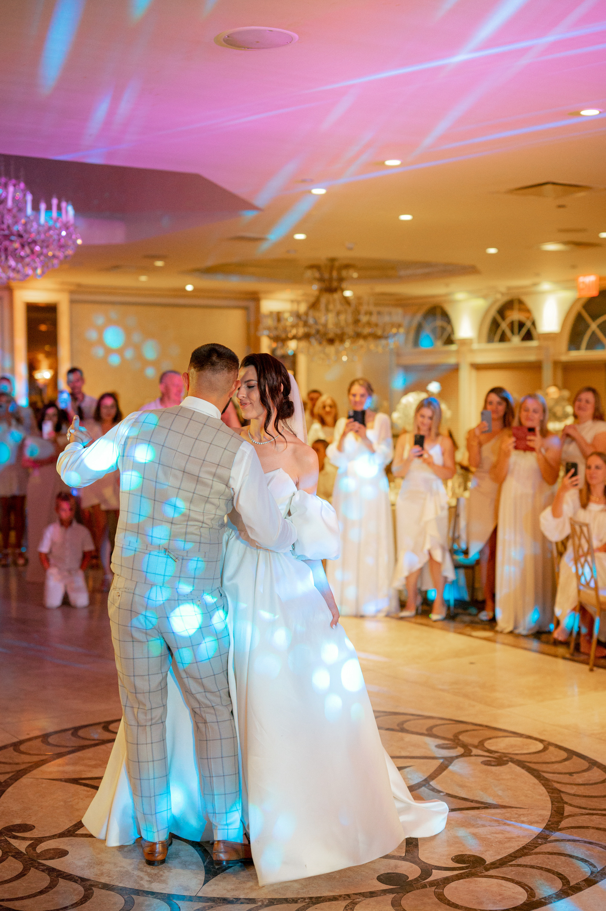 a bride and groom dance together at their wedding reception