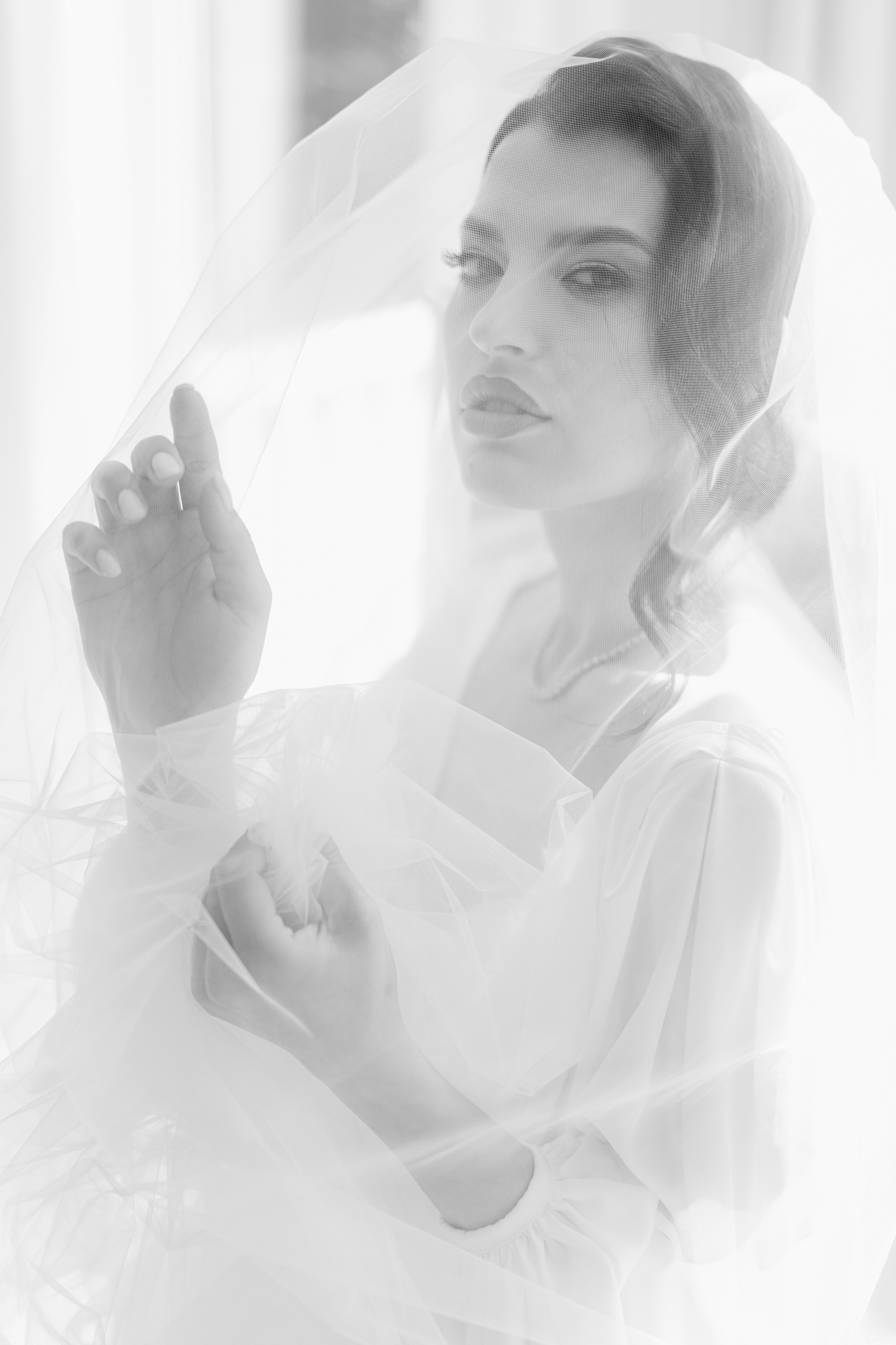 a woman in a wedding dress and veil