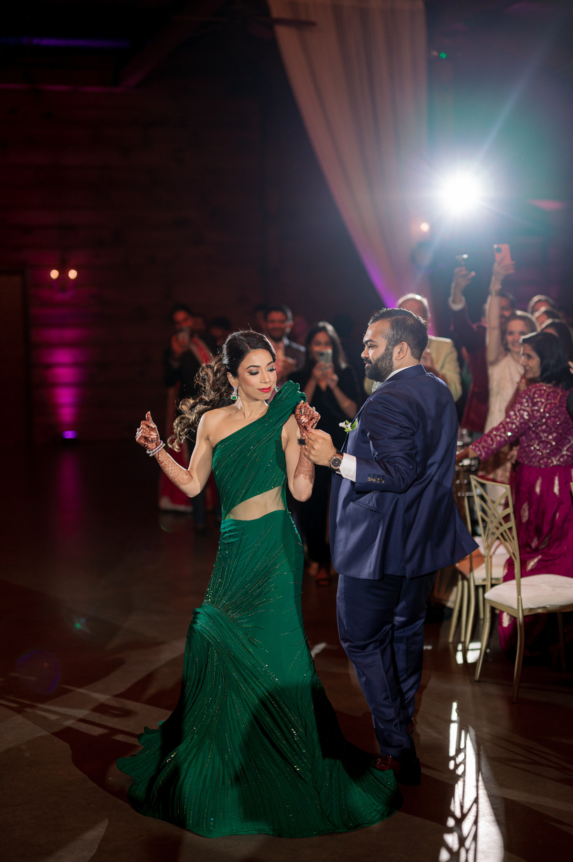 a man and woman dancing on a dance floor