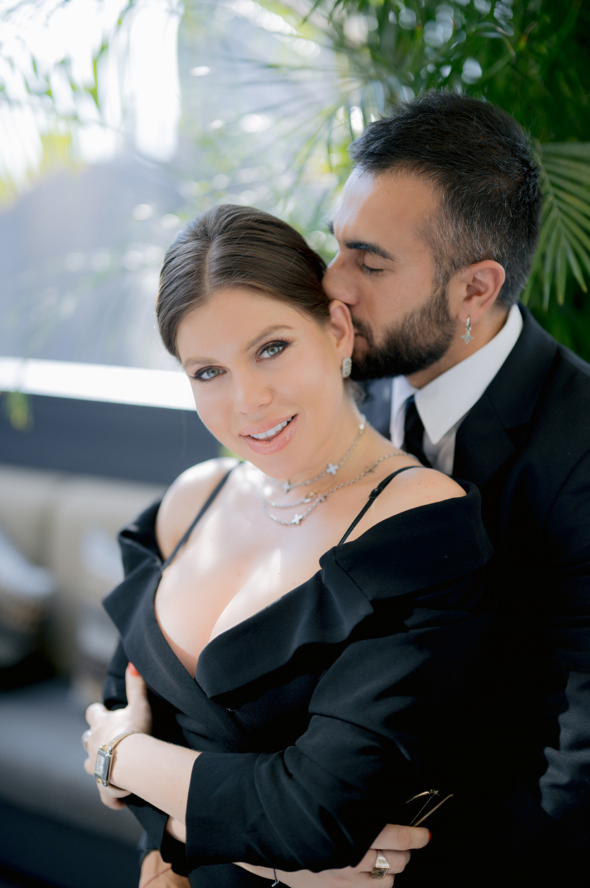 a man and woman are posing for a picture