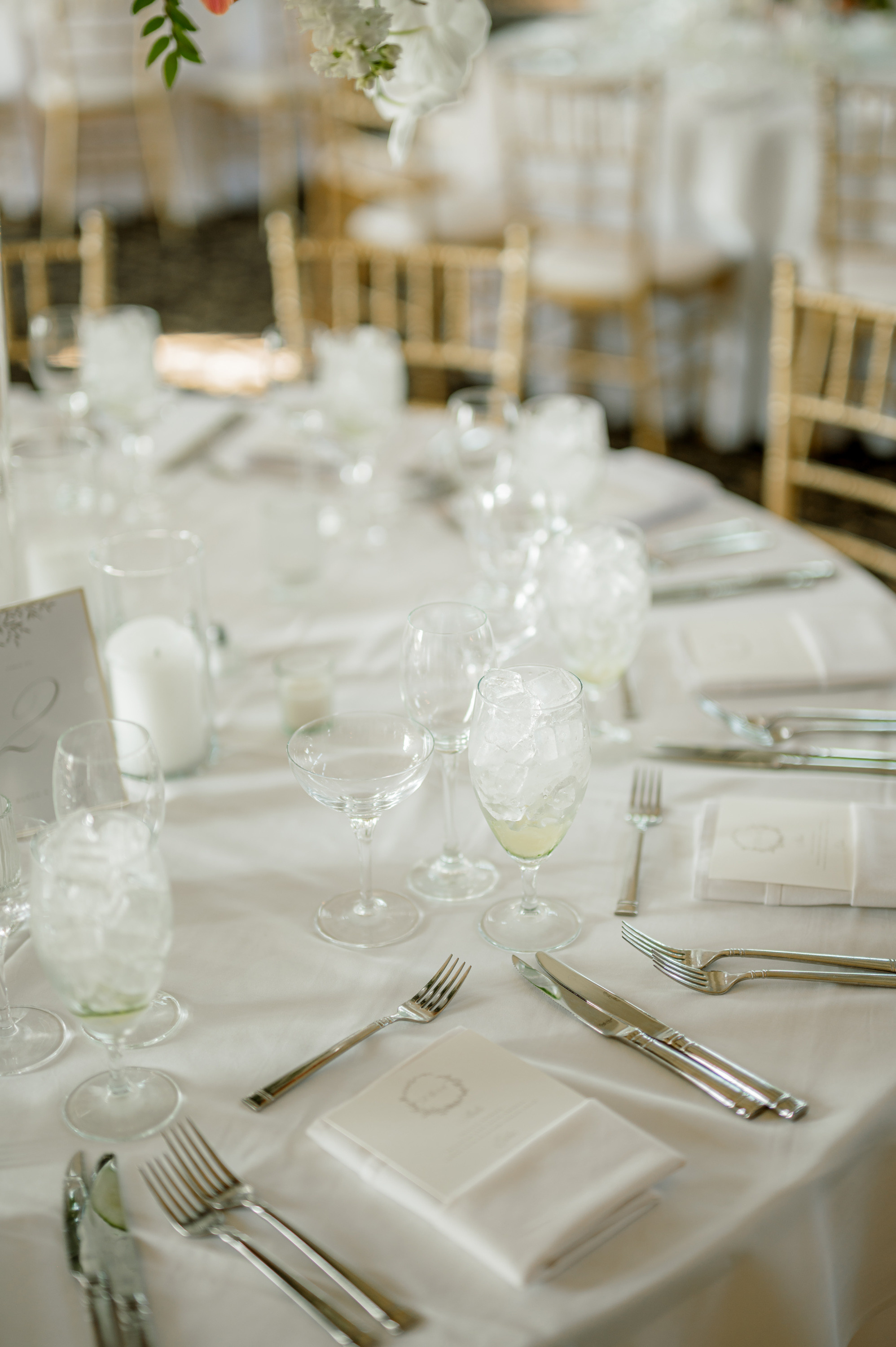 a table with a bunch of flowers and silverware