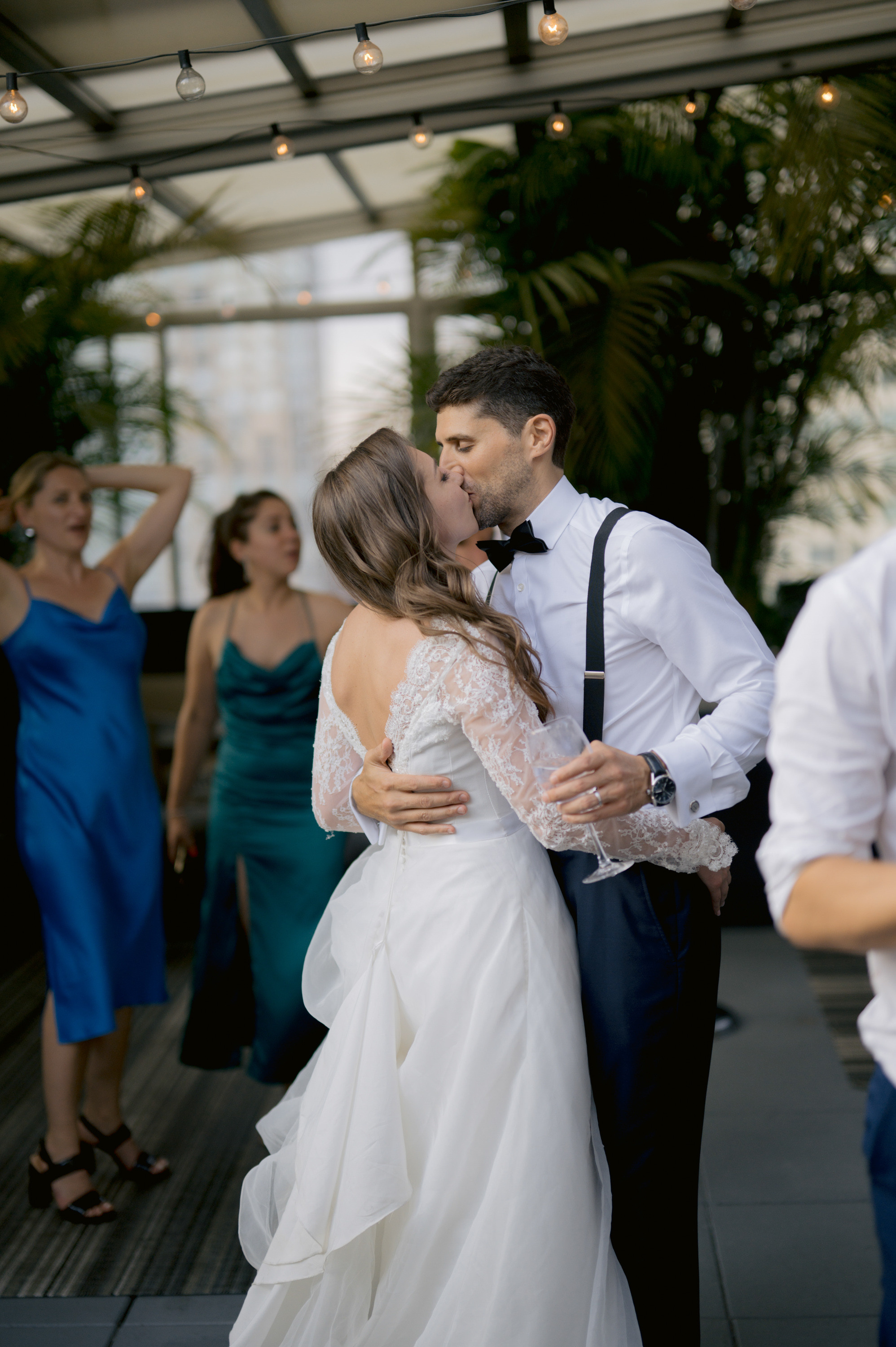 a bride and groom sharing a kiss on the dance floor