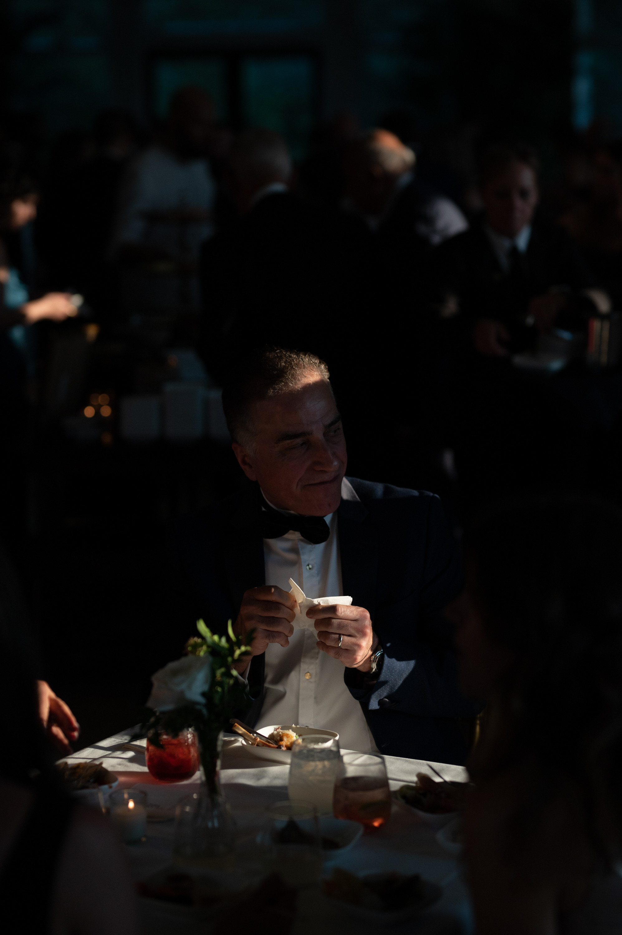 a man in a suit eating a meal