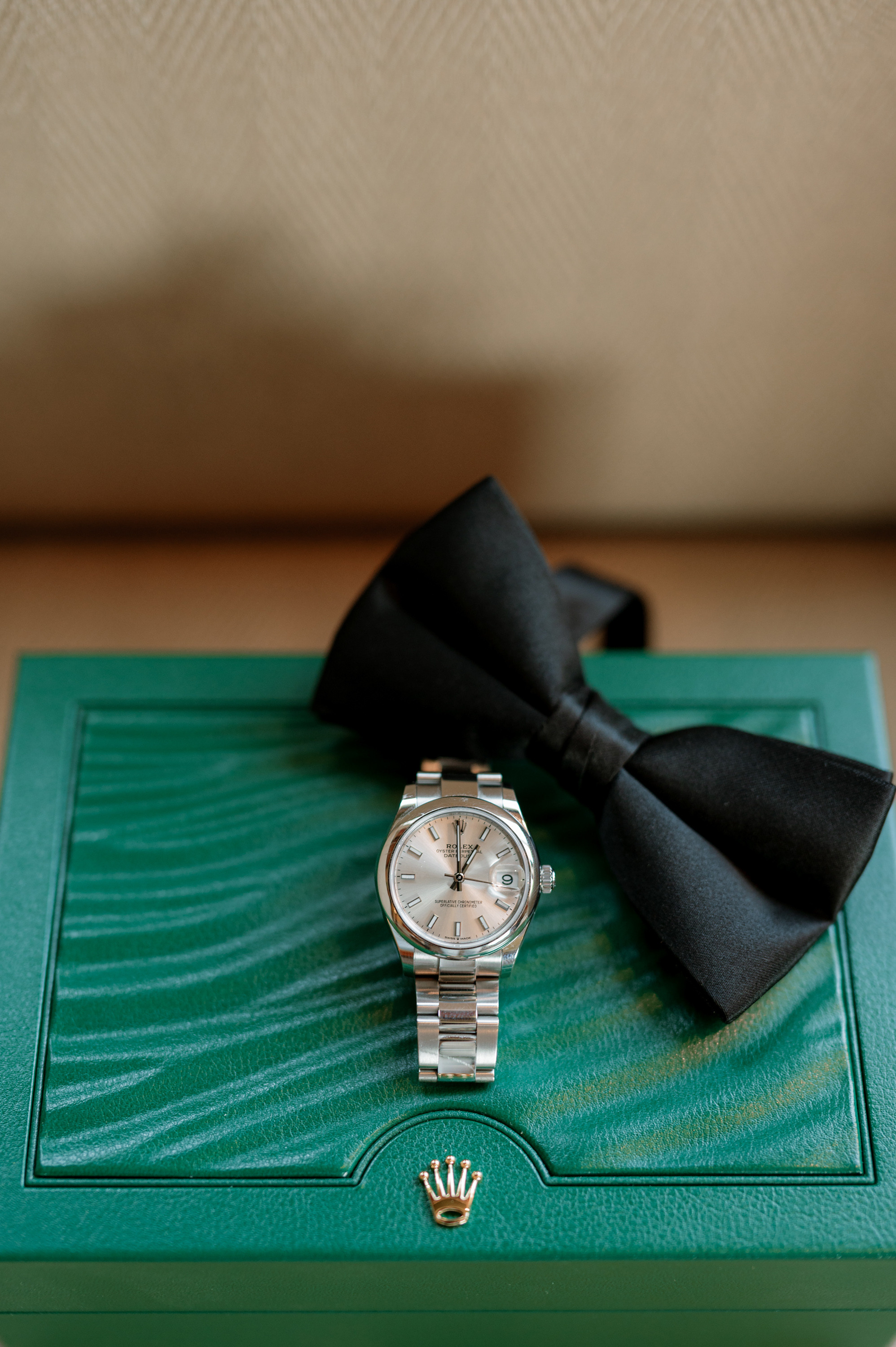 a watch on a green box