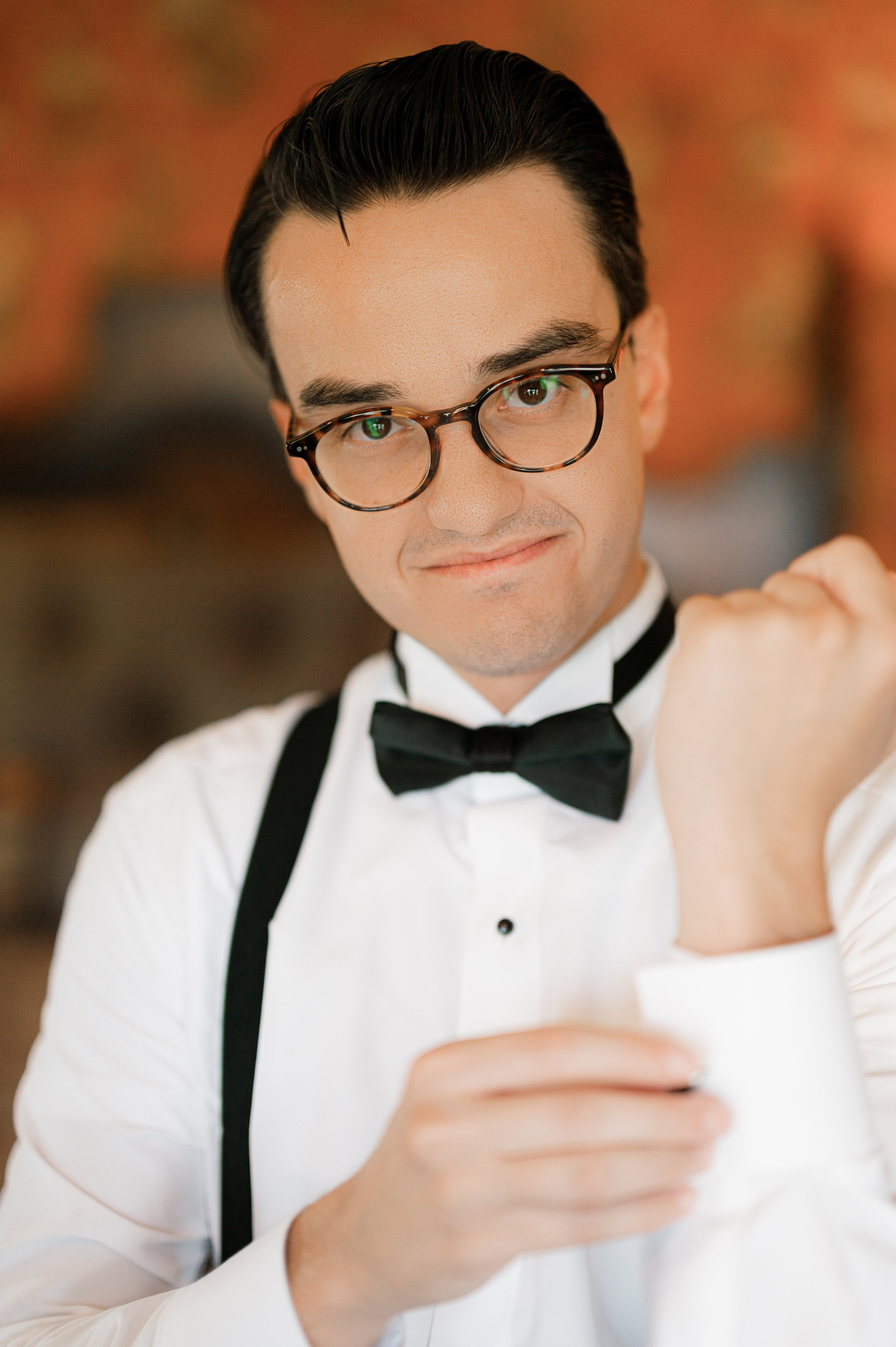 a man wearing a bow tie and glasses