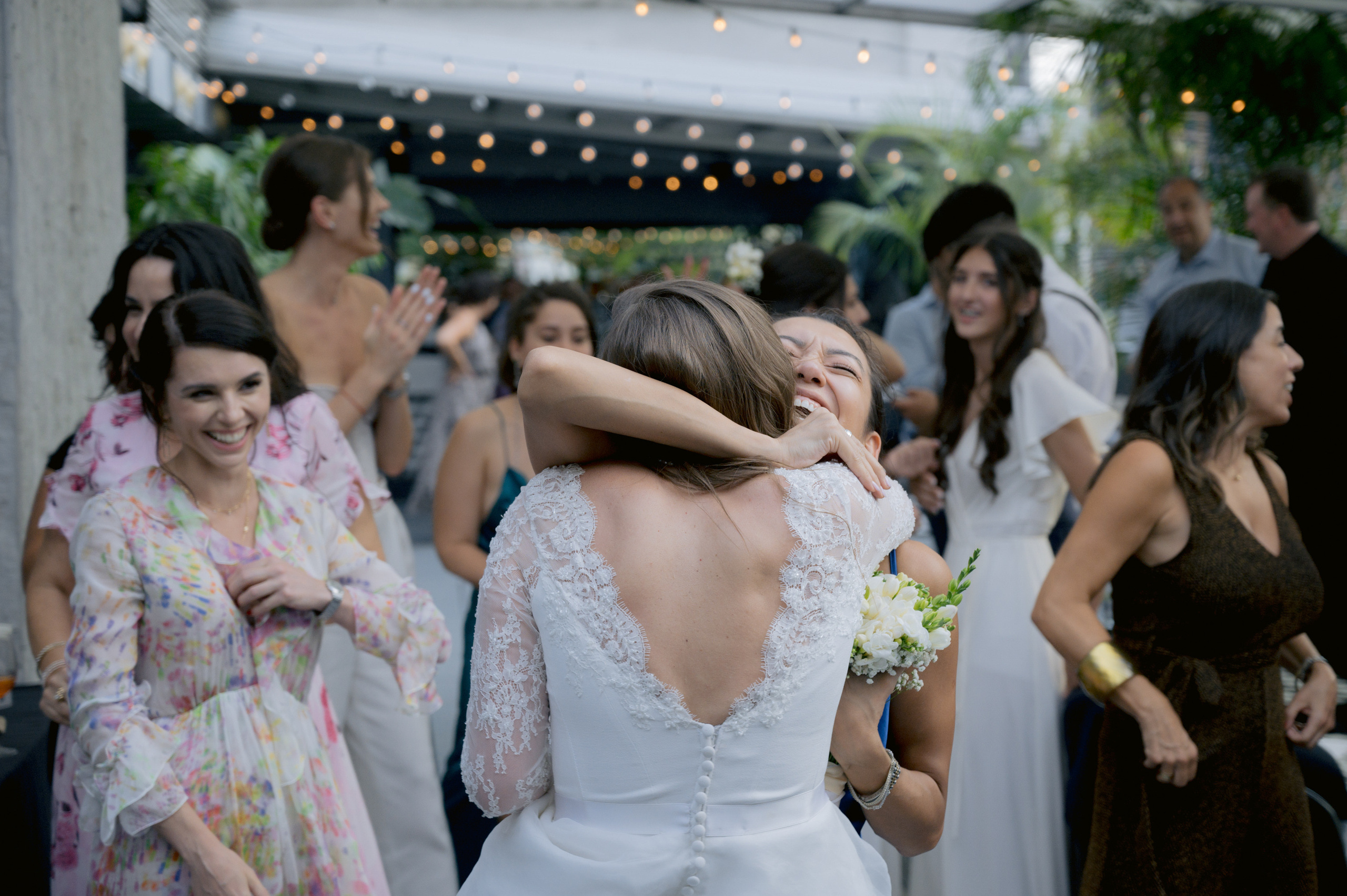 a bride hugging her friend
