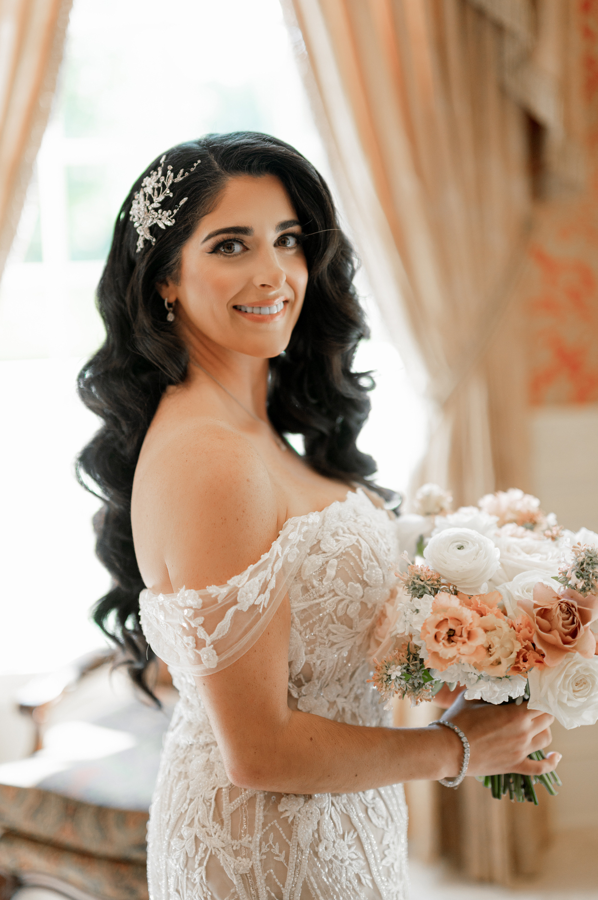a bride holding a bouquet of flowers