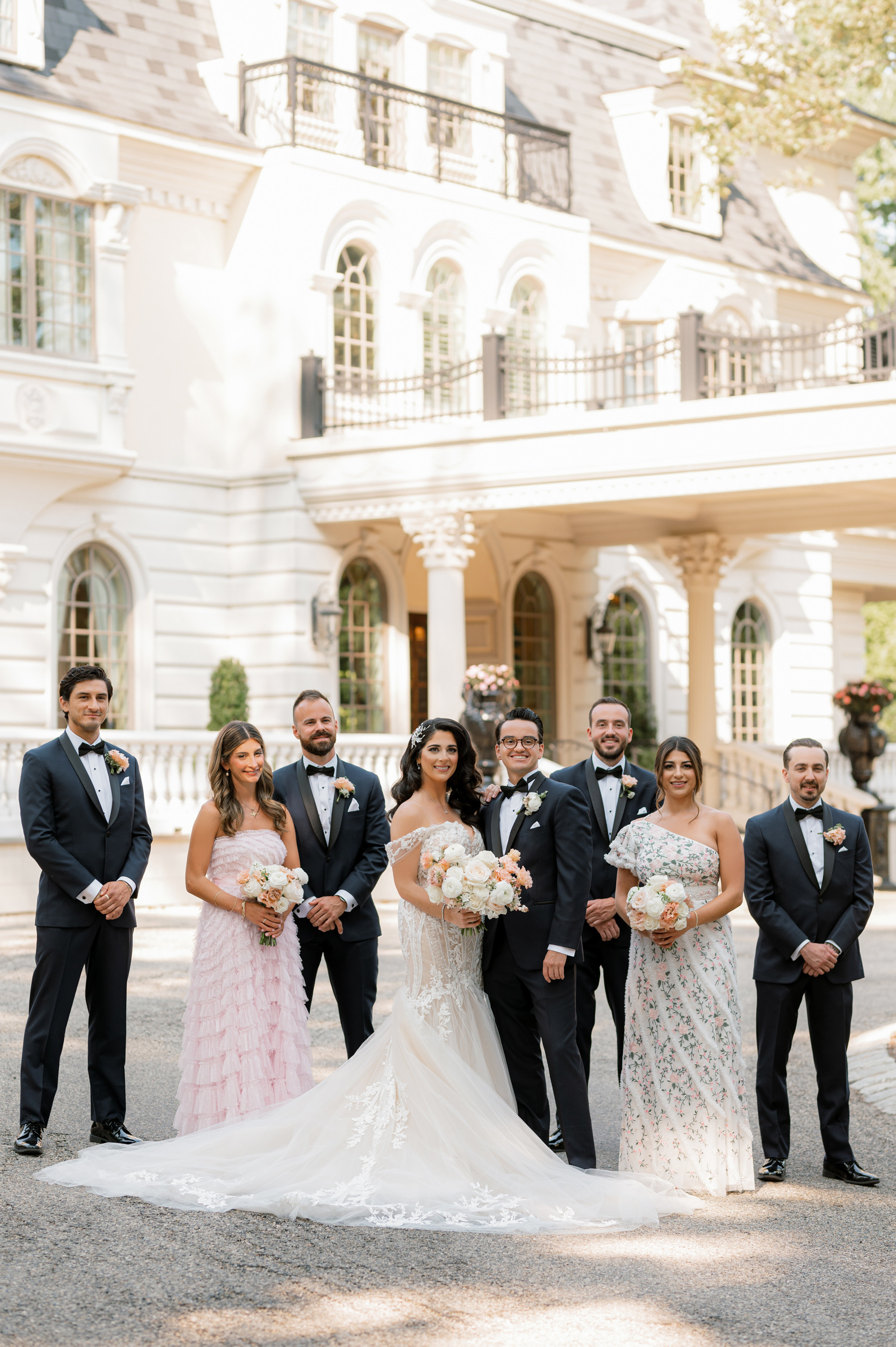 a group of people standing in front of a large building