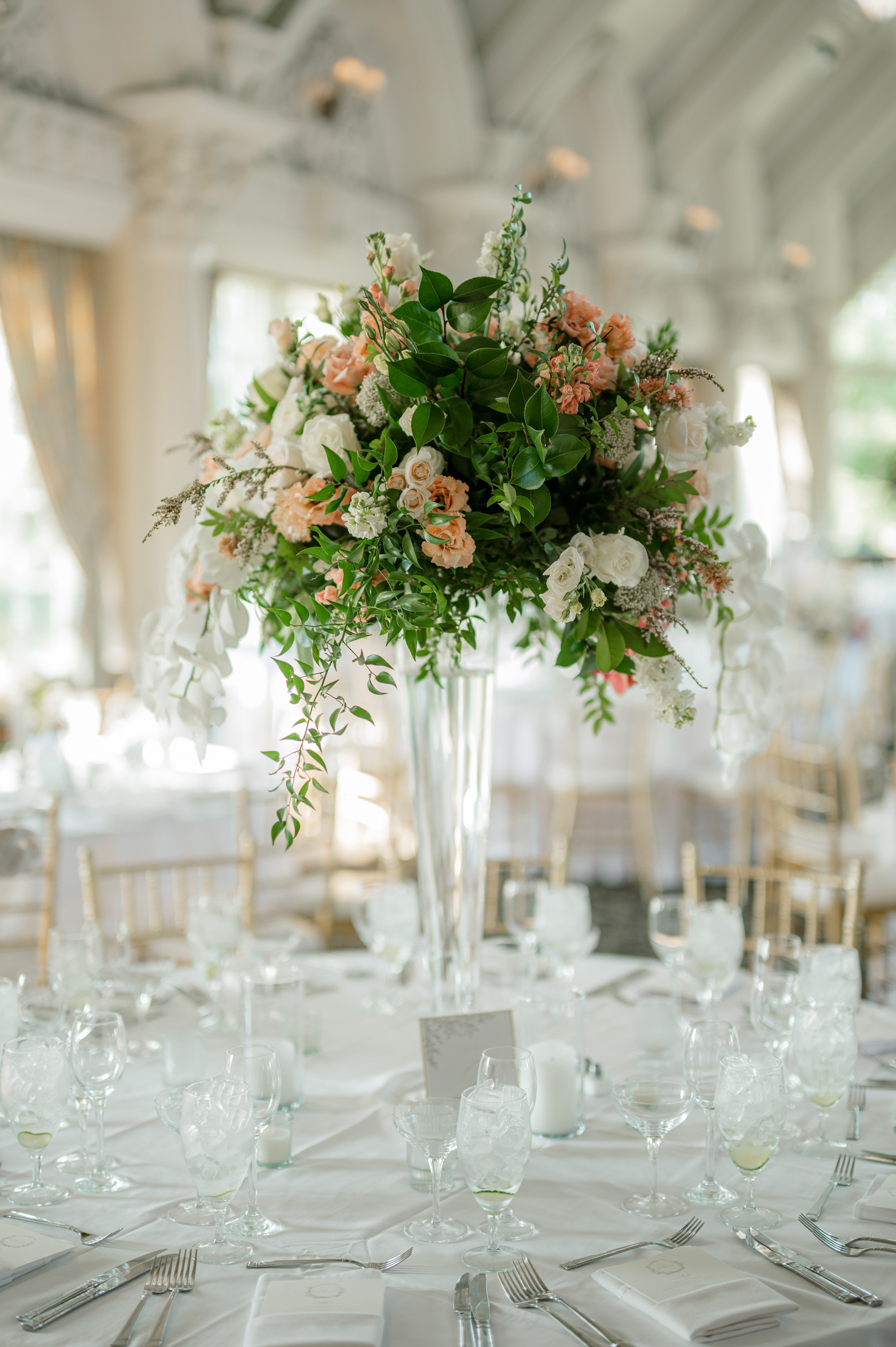 a table with white and pink flowers in a vase