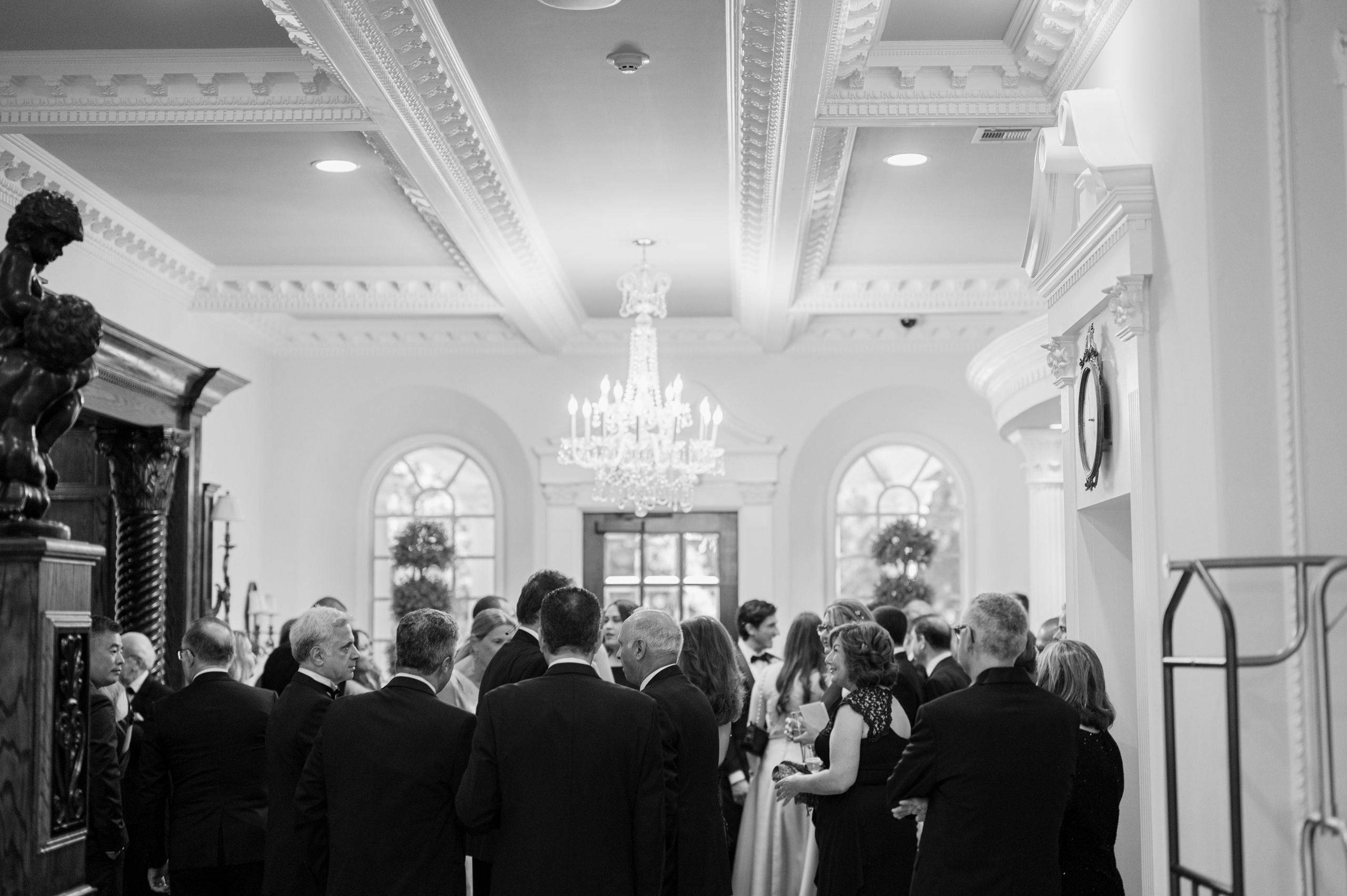 a group of people standing in a hallway