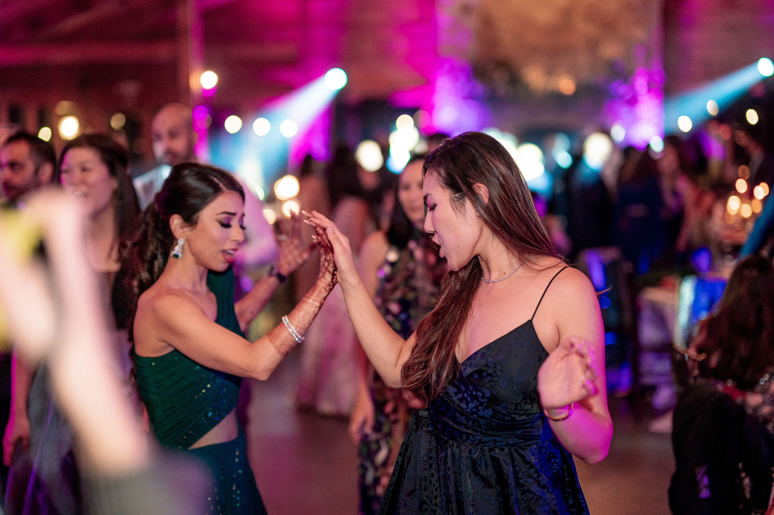 a group of people dancing at a party