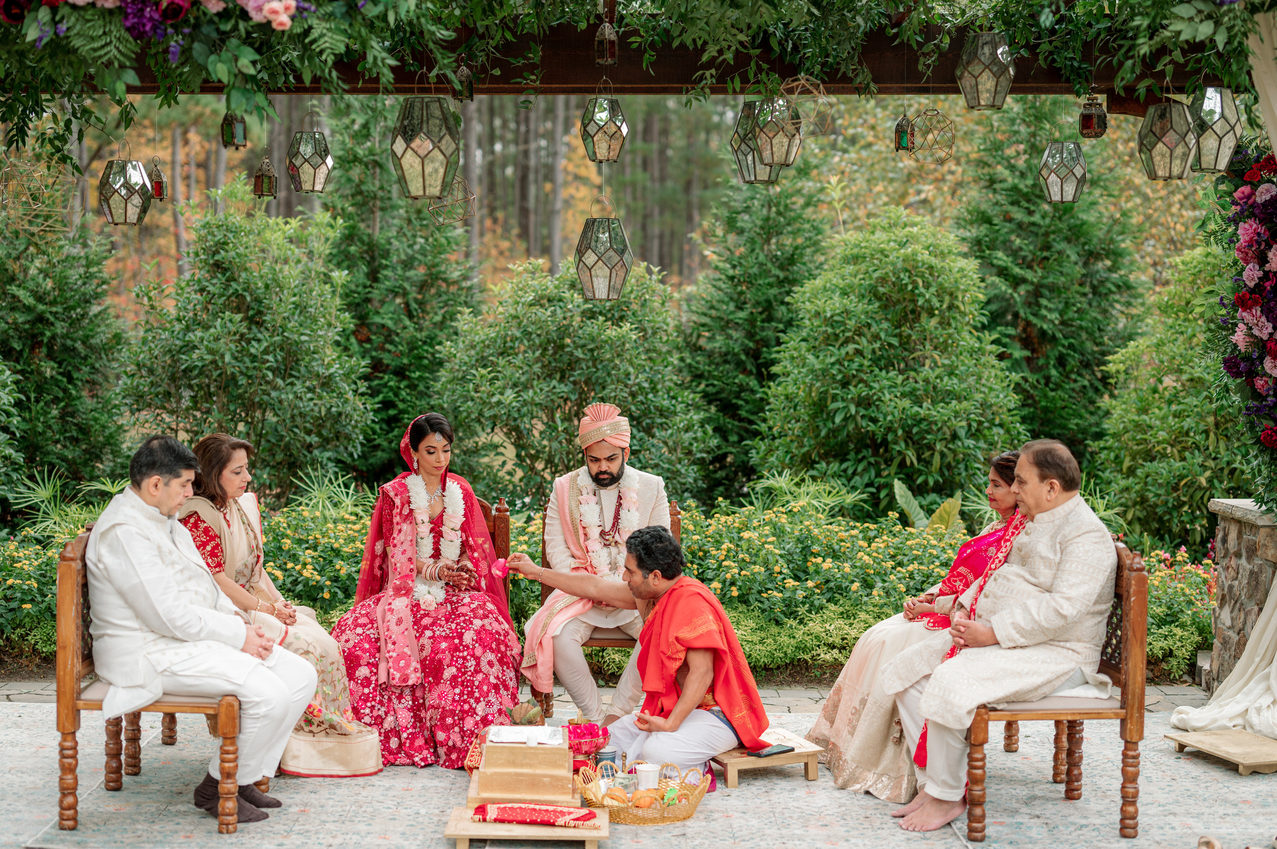 a group of people sitting on wooden chairs