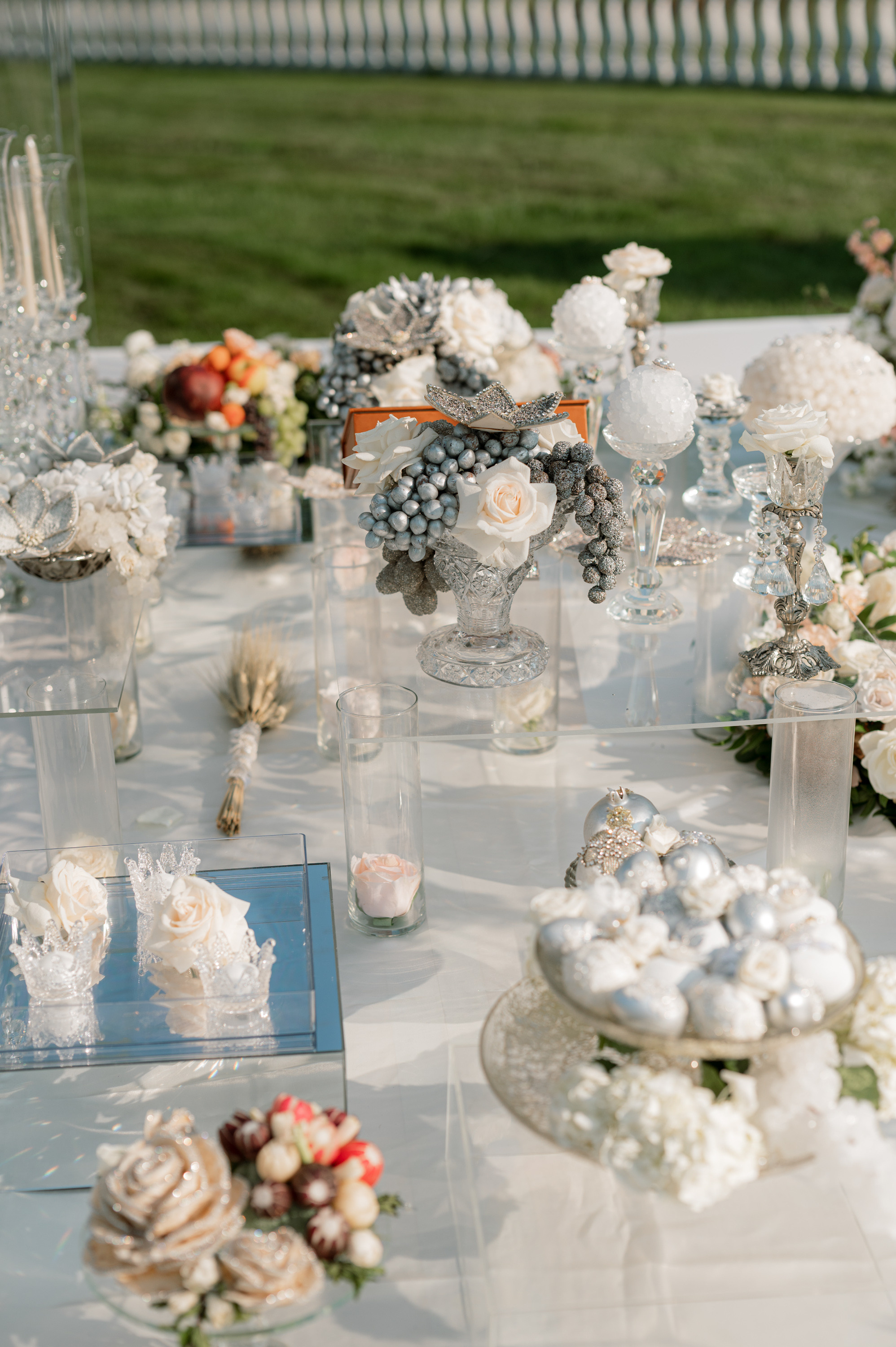 a table with a bunch of flowers and a vase