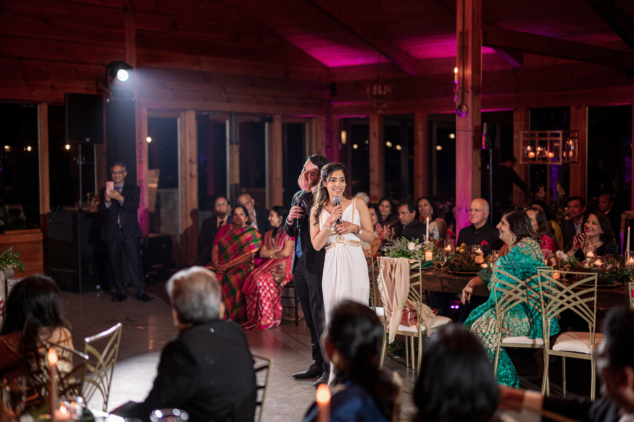 a couple is performing a song at their wedding reception