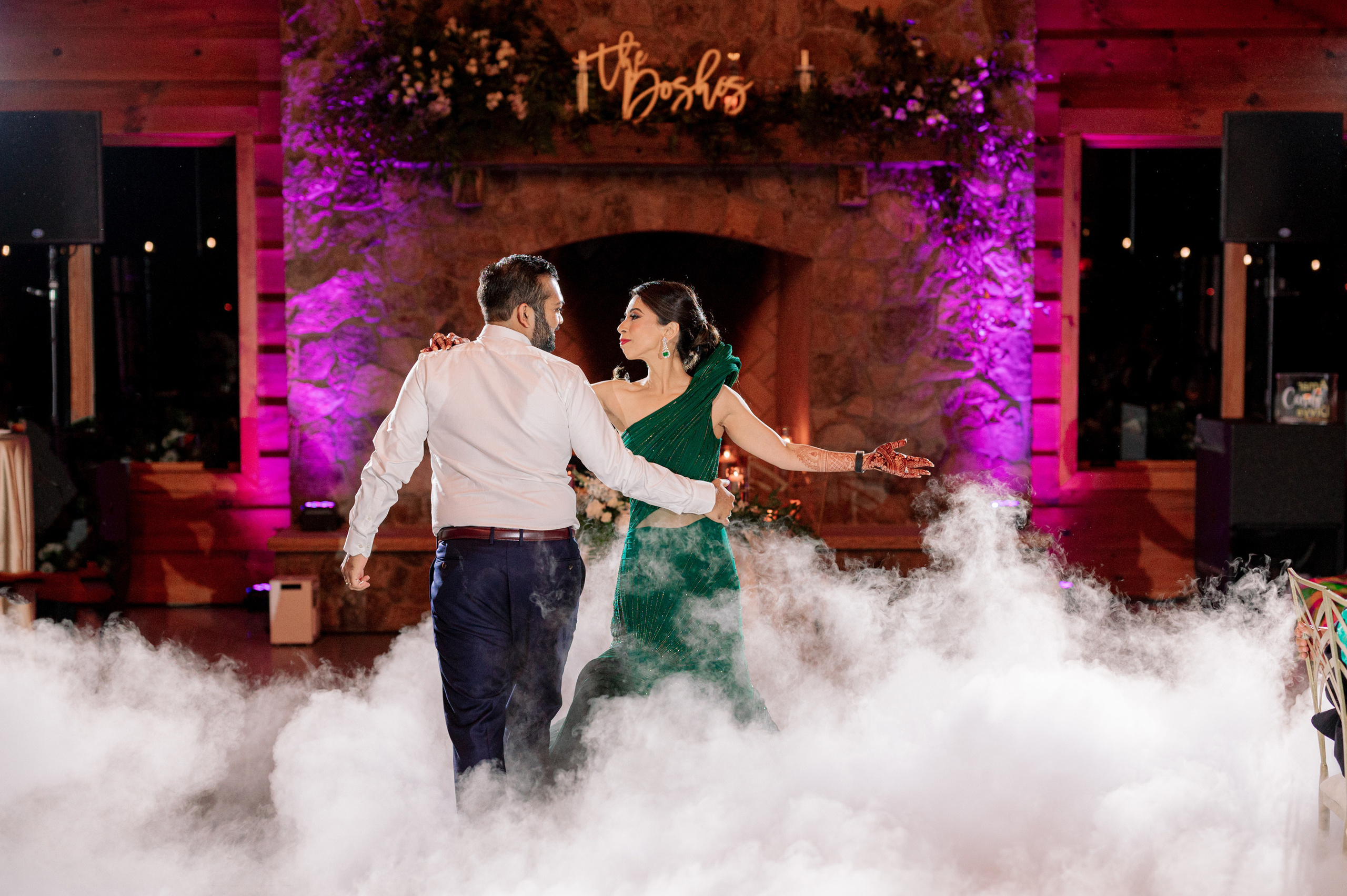 a couple dancing on a cloud filled dance floor