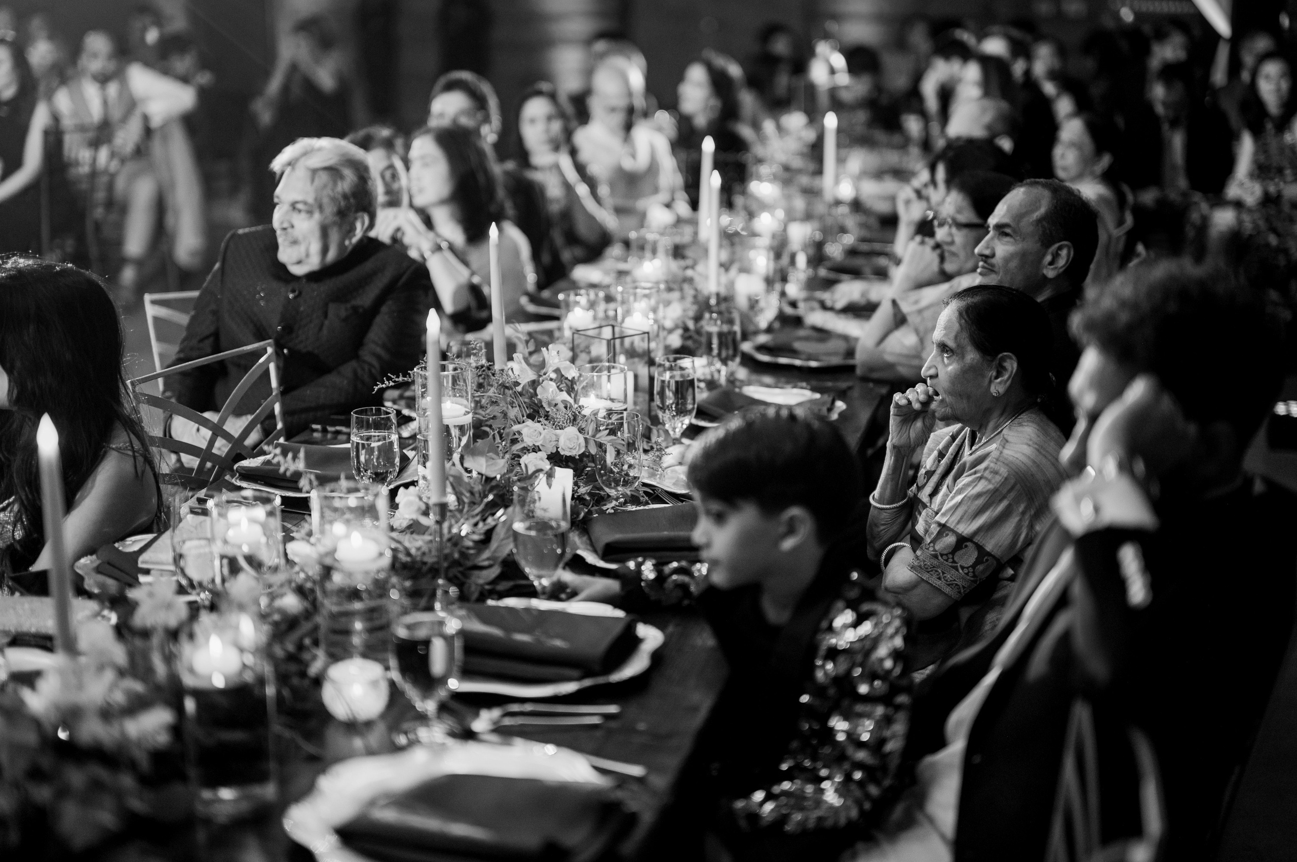 a group of people sitting around a table