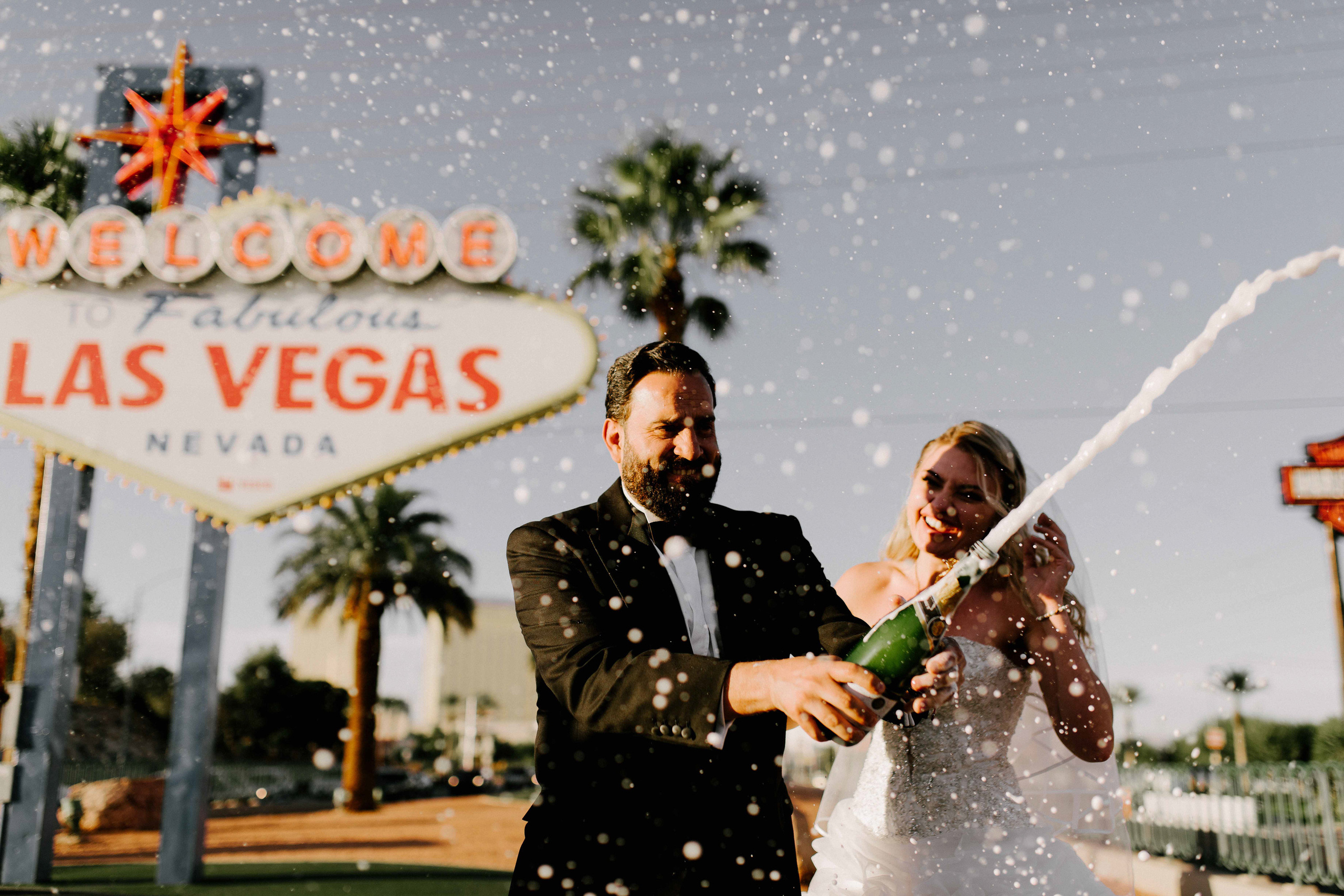a newly bride and groom are showered with champagne