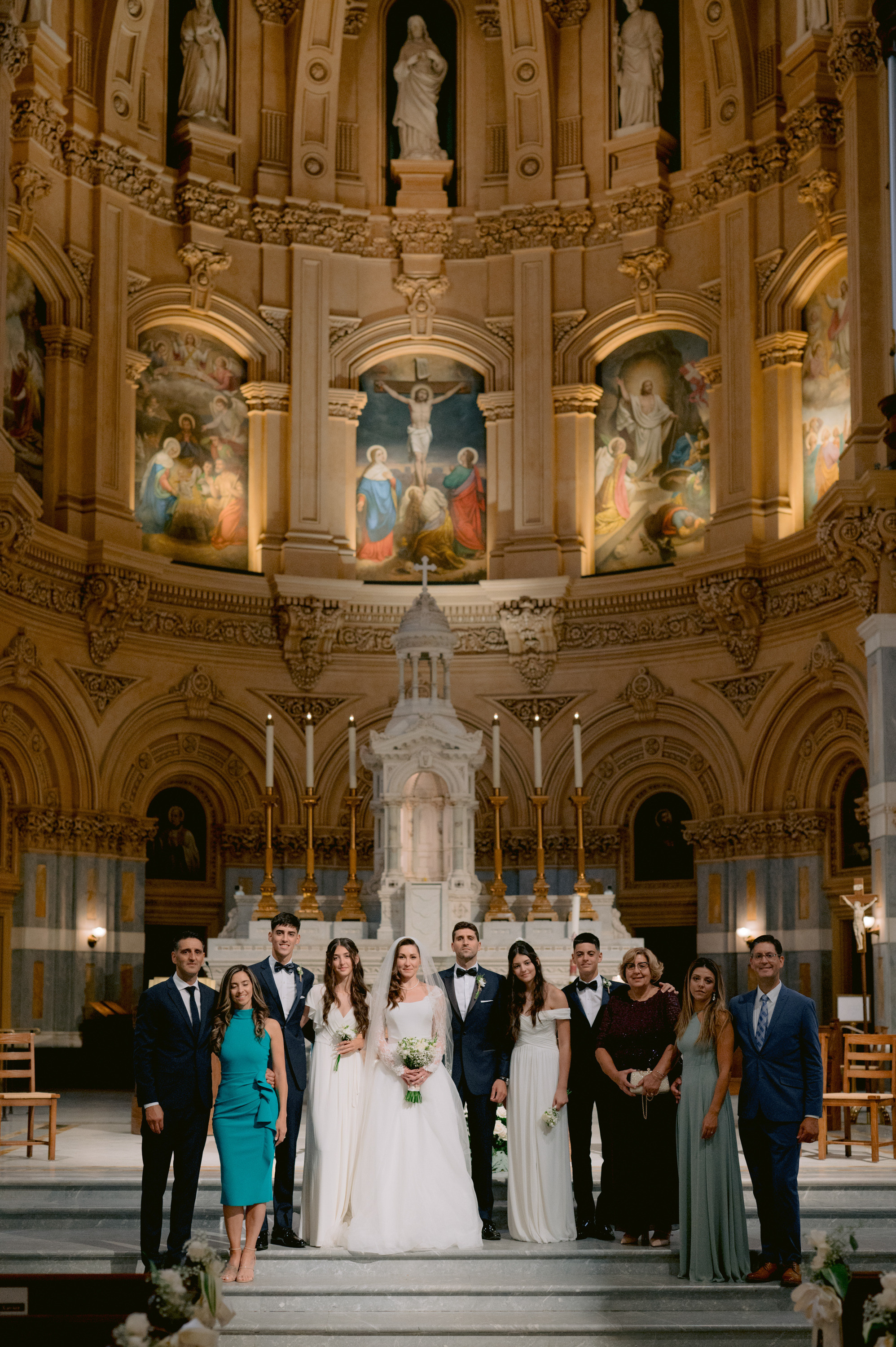a group of people standing in front of a church