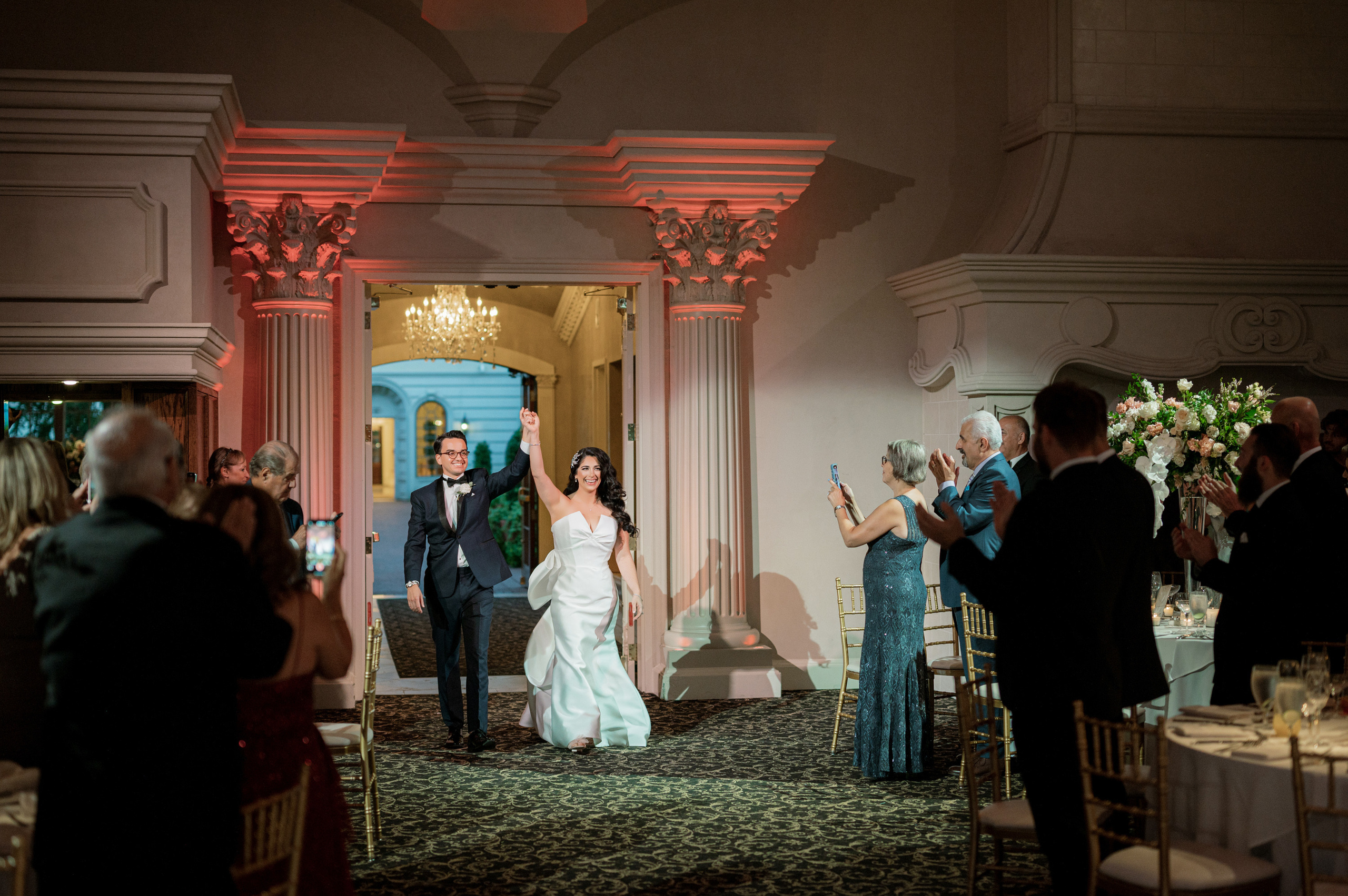 a bride and groom walking down the aisle