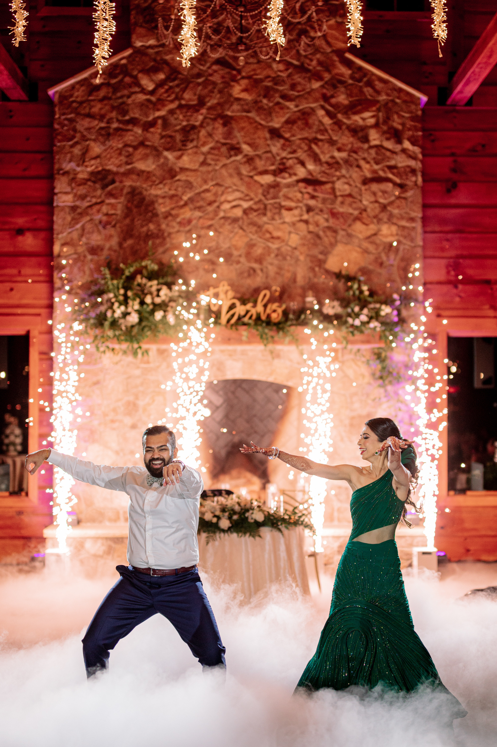 a couple dancing in the clouds at their wedding