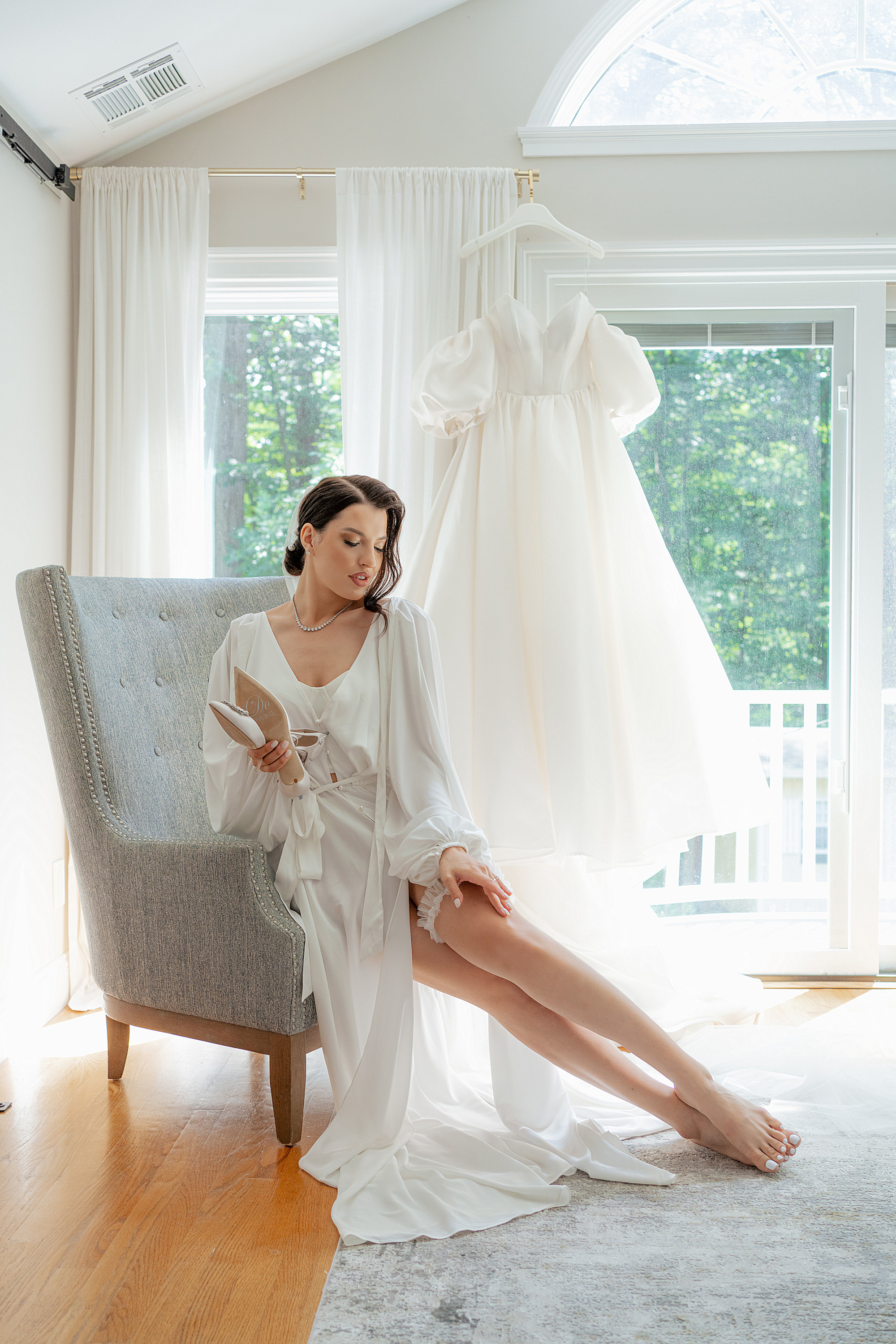 a woman sitting on a chair in a room