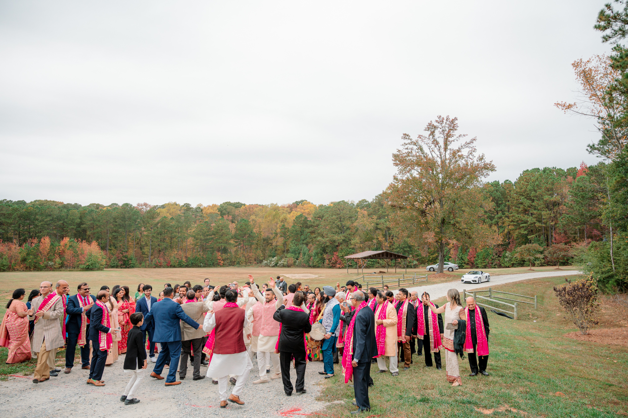 a group of people standing in a field