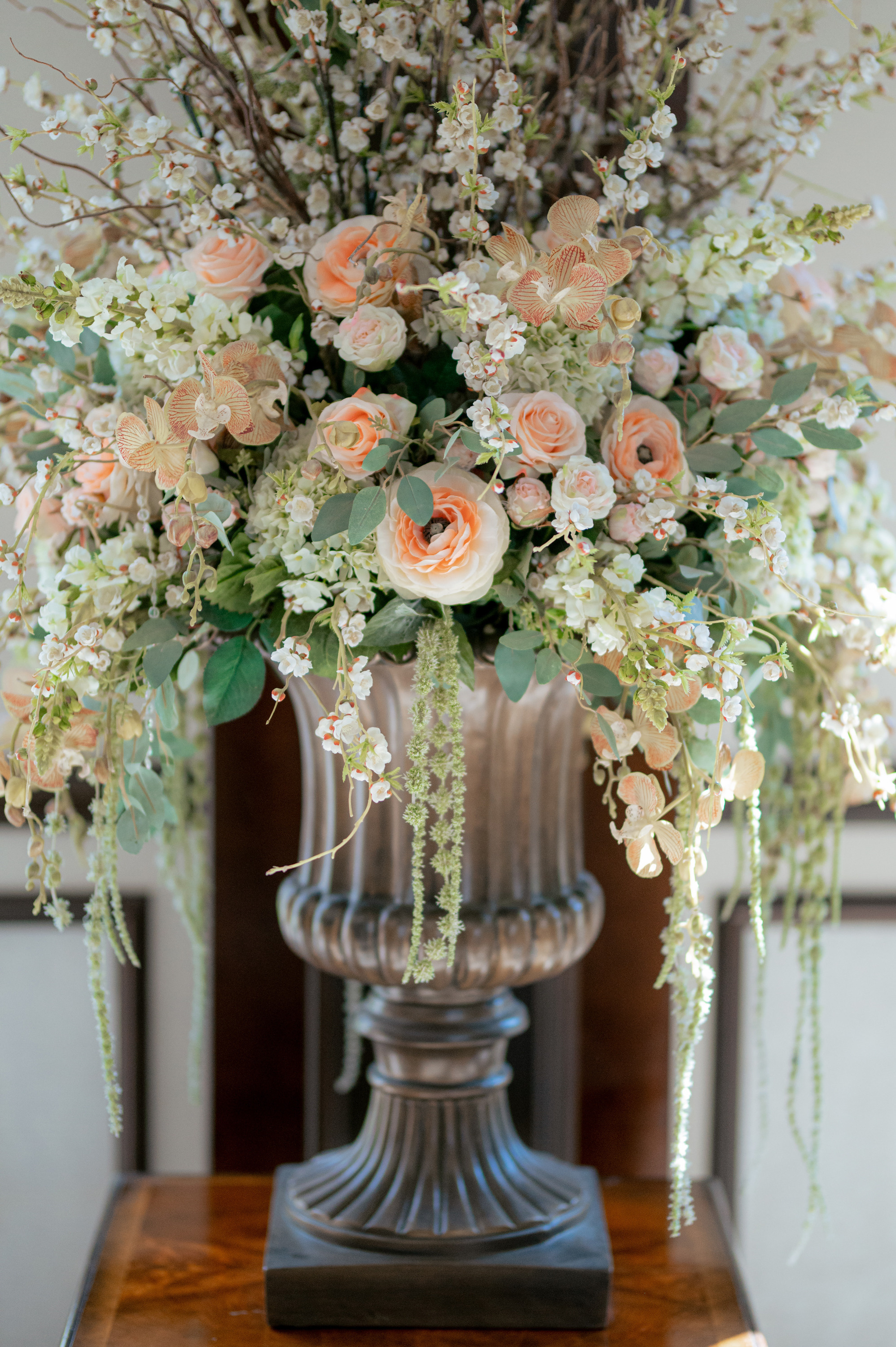 a vase filled with flowers and greene
